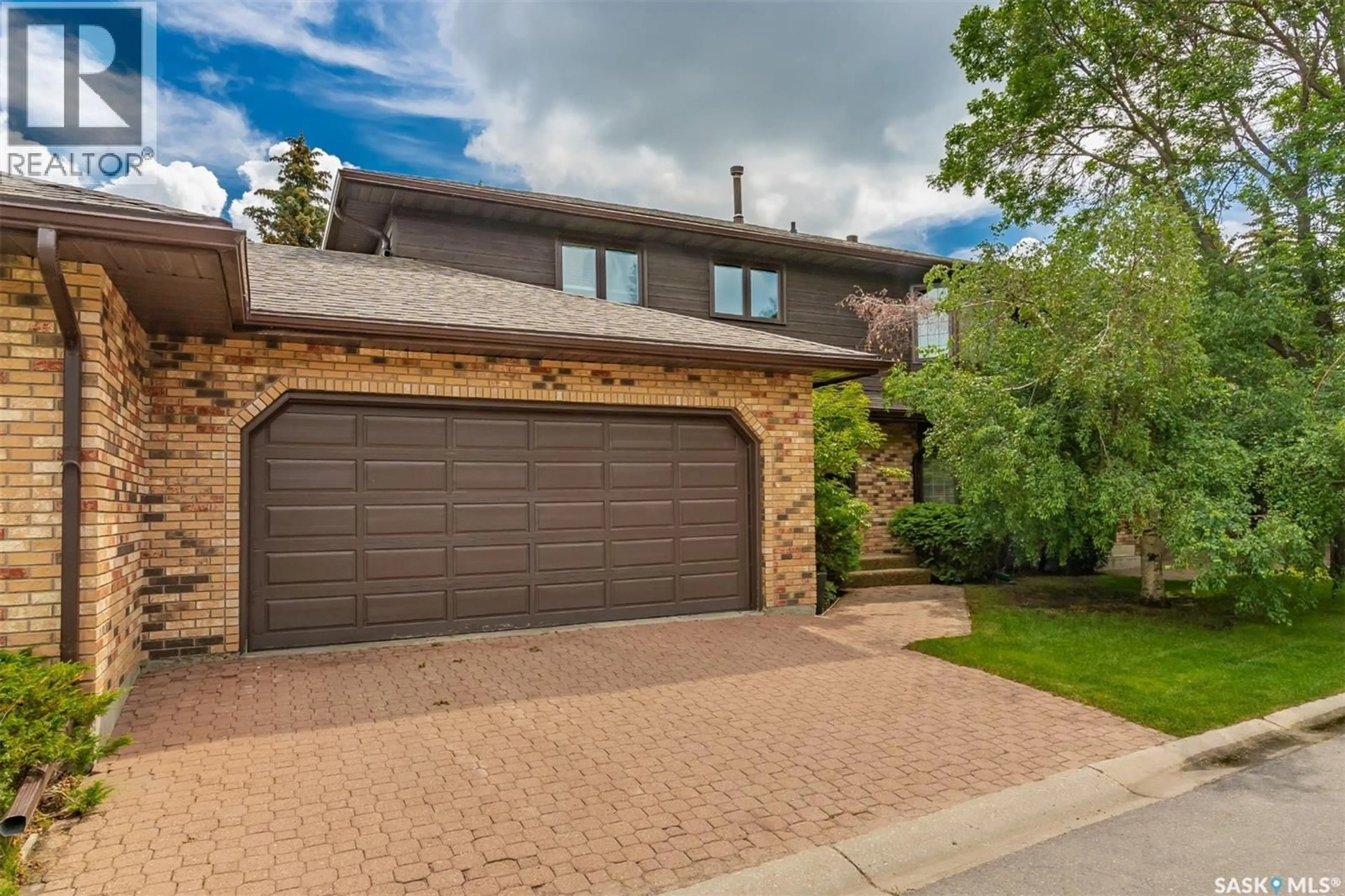 Home with brick exterior material, street for 203 - 415 HERITAGE CRESCENT, Saskatoon Saskatchewan S7H5M5