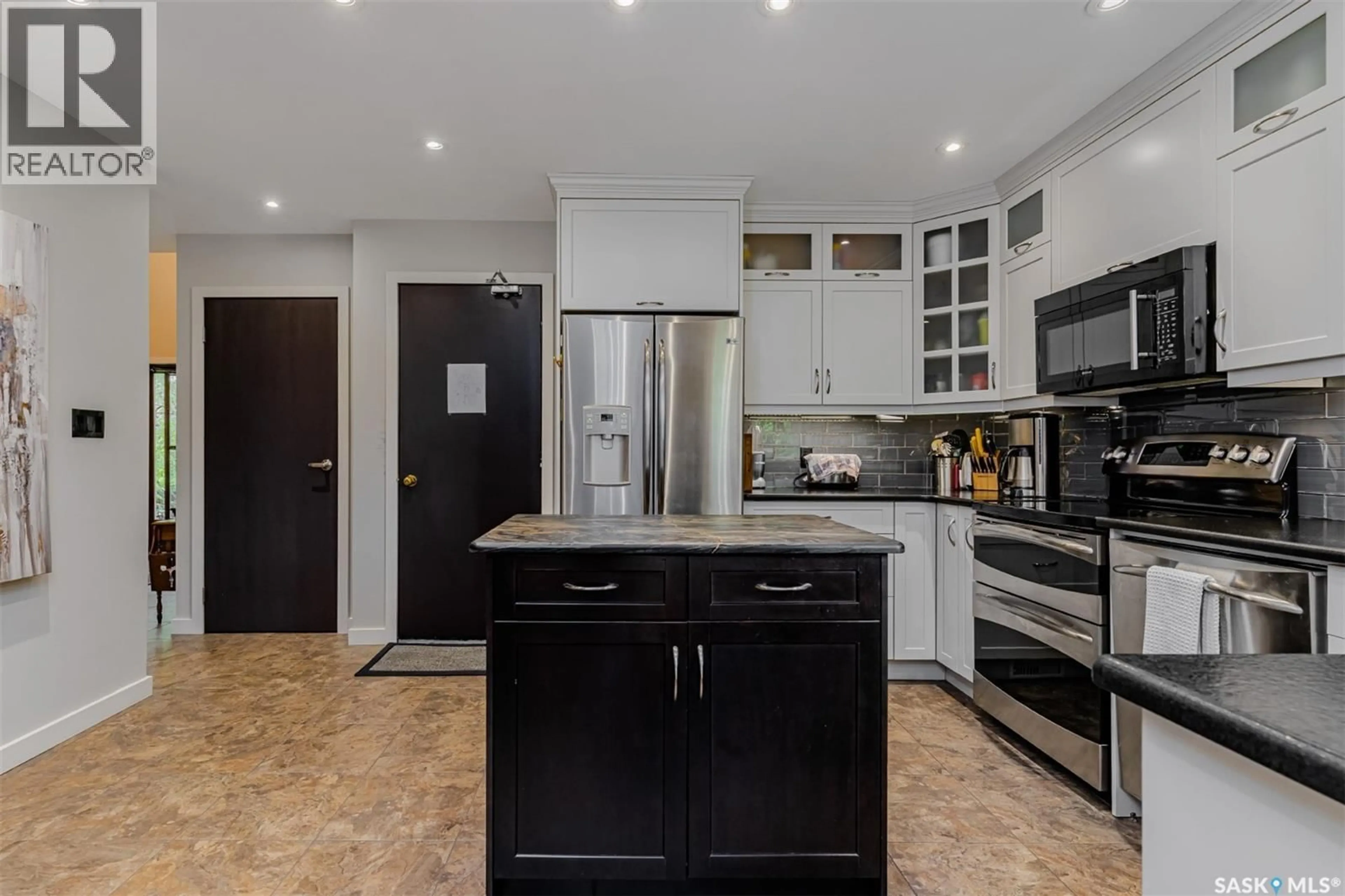 Open concept kitchen, ceramic/tile floor for 203 - 415 HERITAGE CRESCENT, Saskatoon Saskatchewan S7H5M5