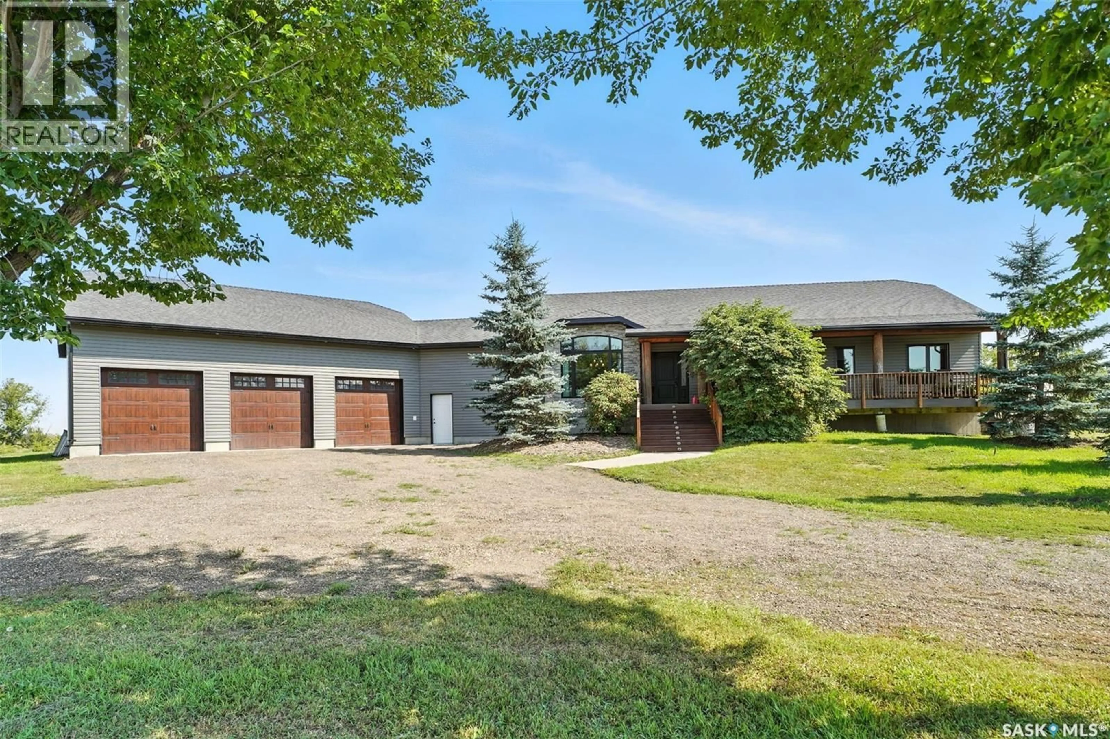 A pic from outside/outdoor area/front of a property/back of a property/a pic from drone, street for WIEBE ACREAGE, Vanscoy Rm No. 345 Saskatchewan S0L3J0