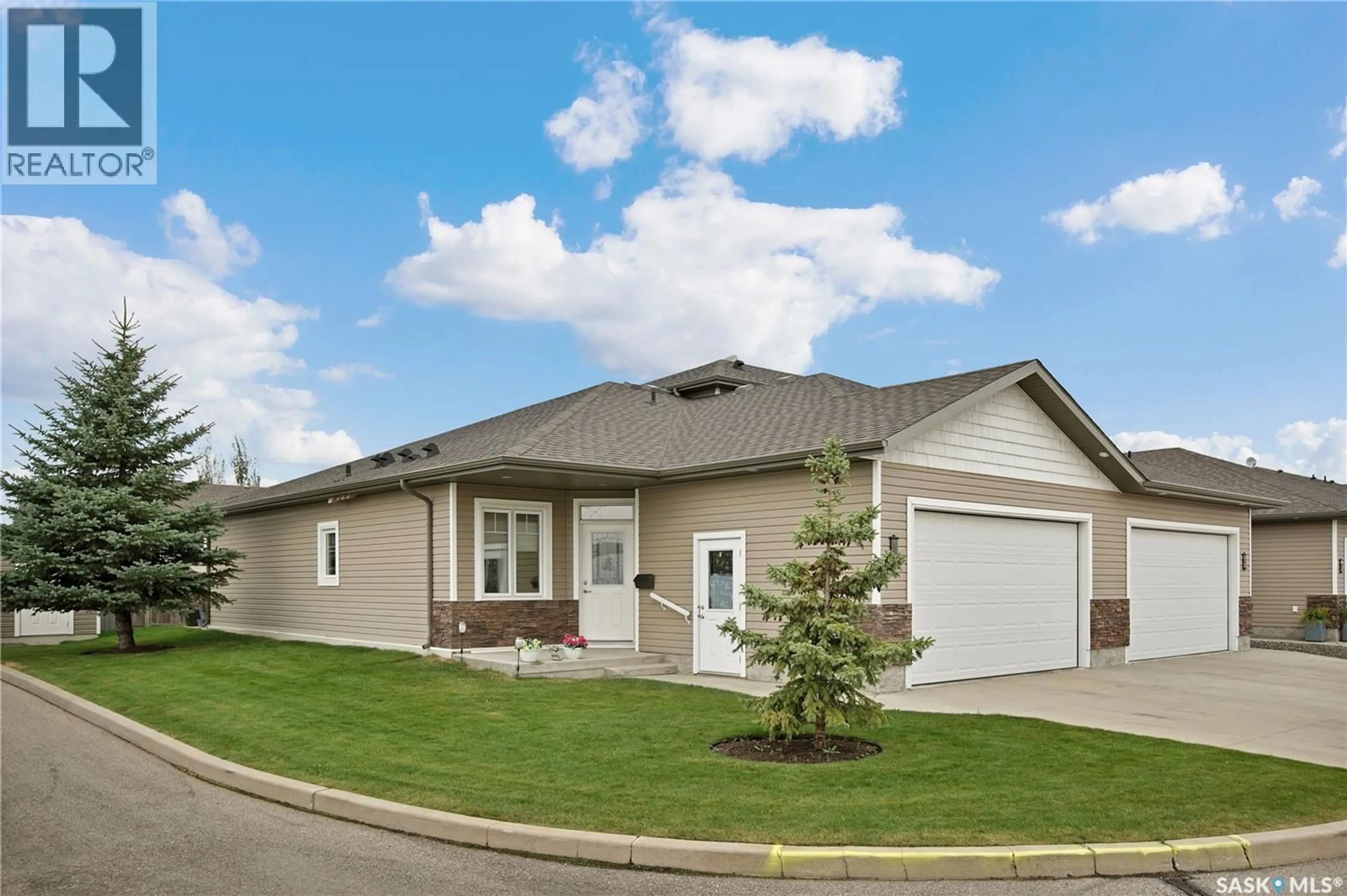Home with vinyl exterior material, street for 1 100 BROOKLYN LANE, Warman Saskatchewan S0K0A1