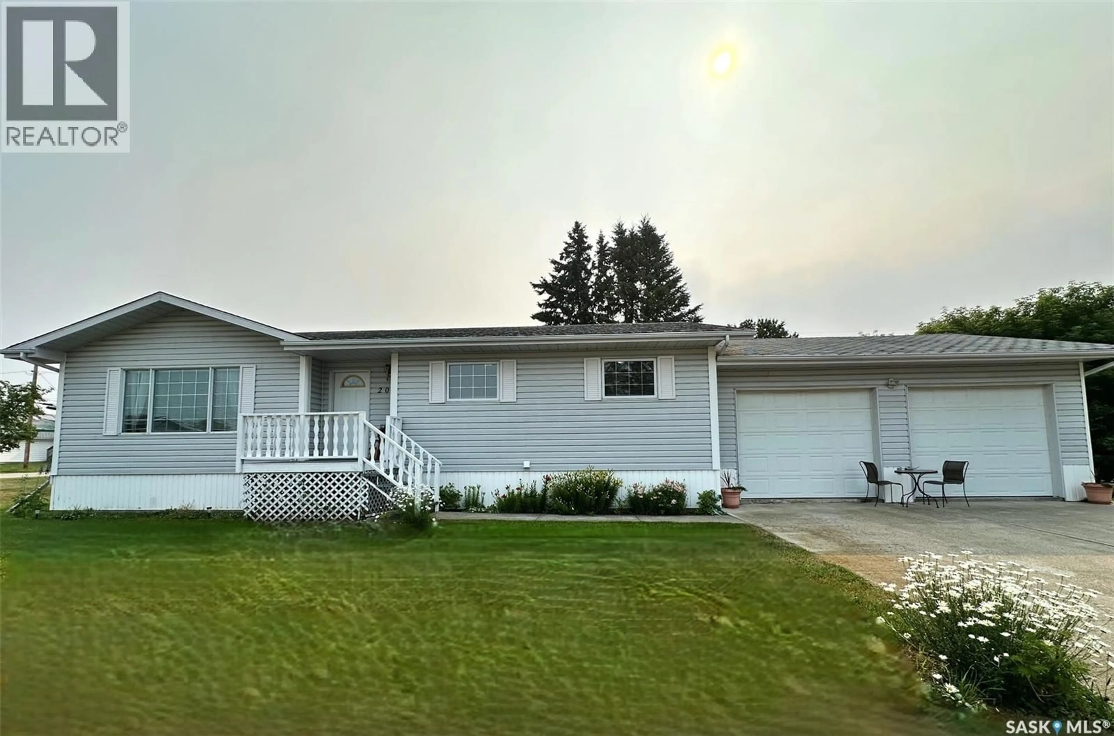 Home with vinyl exterior material, street for 202 HAMJEA STREET, Hudson Bay Saskatchewan S0E0Y0