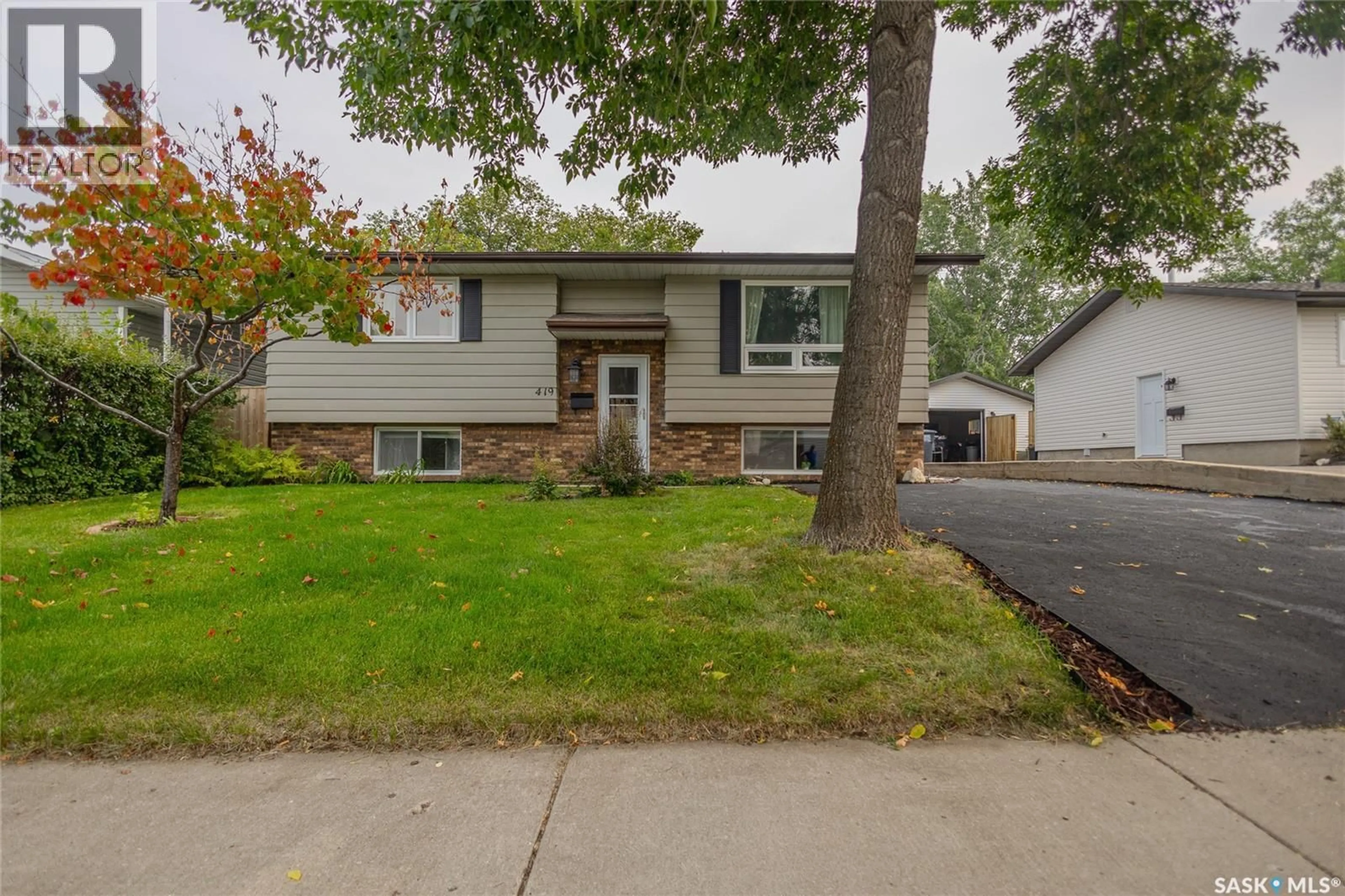 Home with vinyl exterior material, street for 419 STREB WAY, Saskatoon Saskatchewan S7M4V2