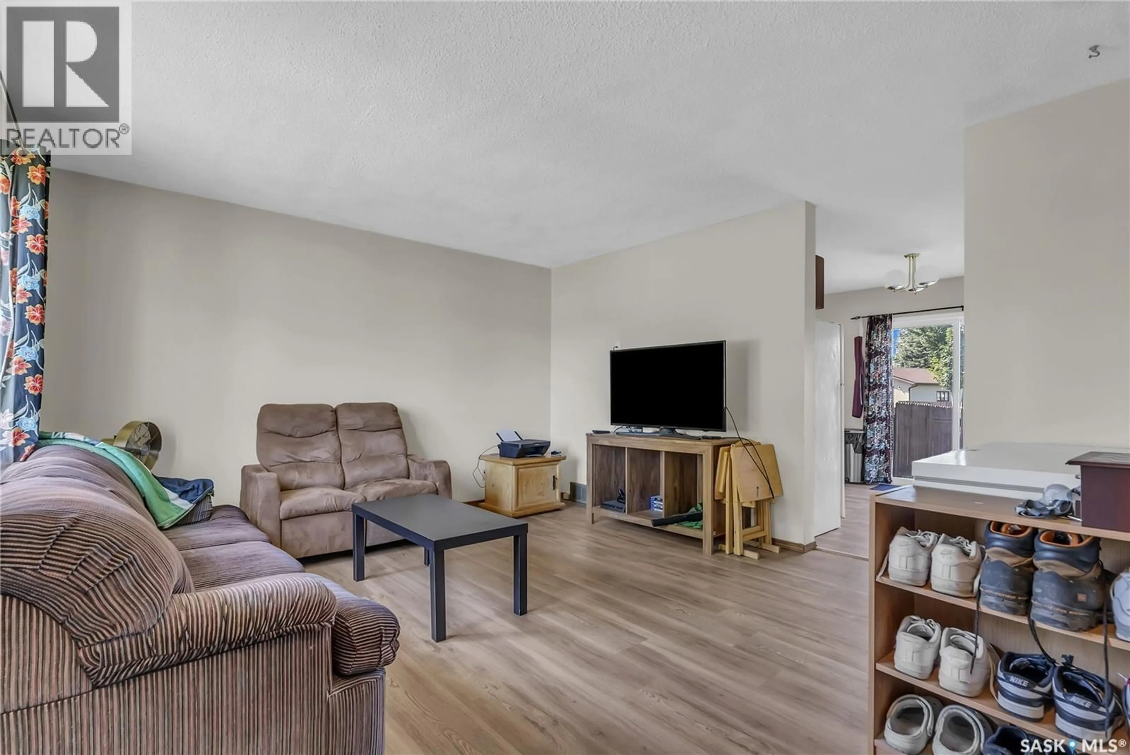 Living room with furniture, unknown for 458 & 460 BERINI DRIVE, Saskatoon Saskatchewan S7N3N6