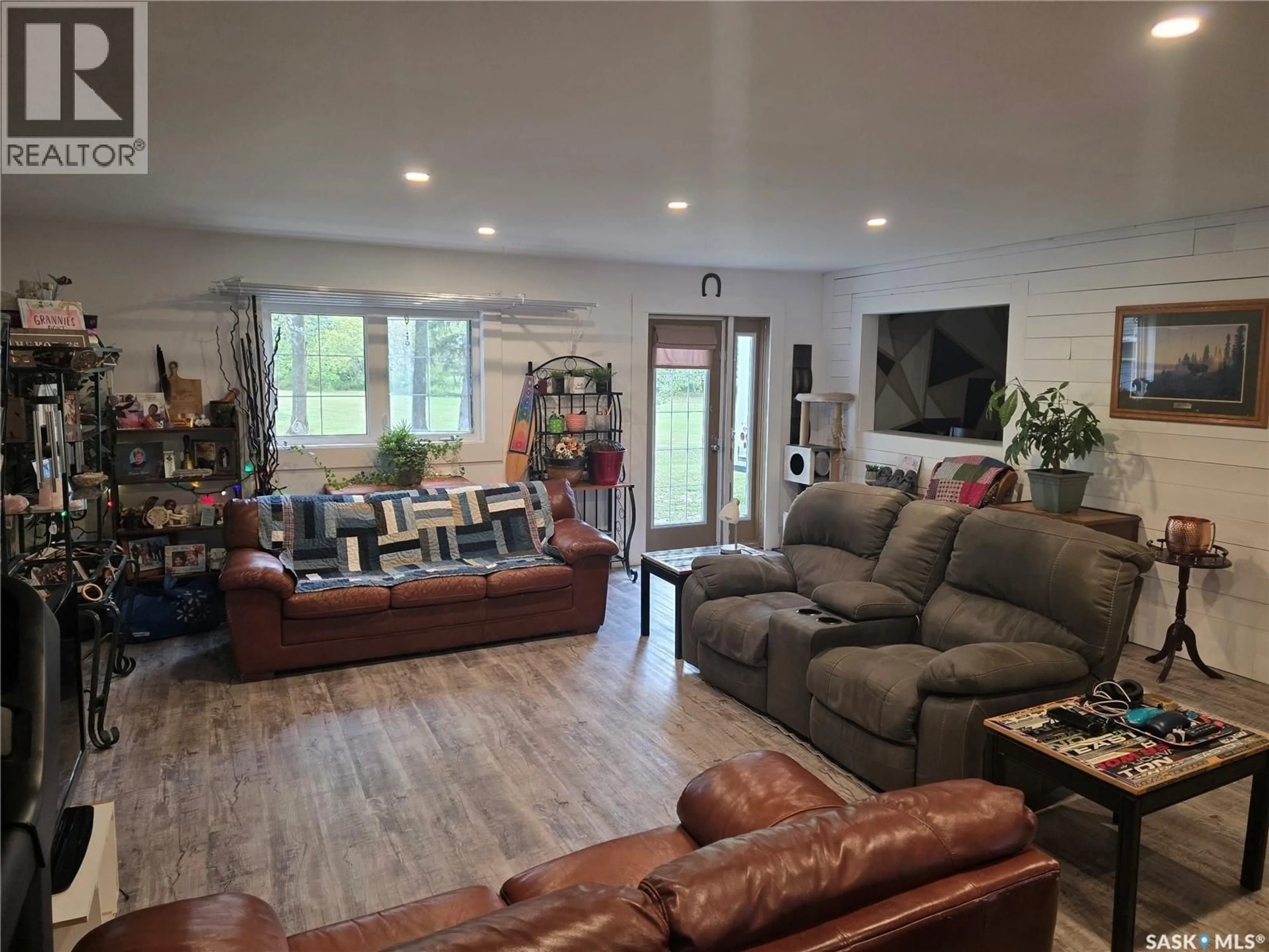 Living room with furniture, wood/laminate floor for REID ACREAGE, Big Quill Rm No. 308 Saskatchewan S0A4T0
