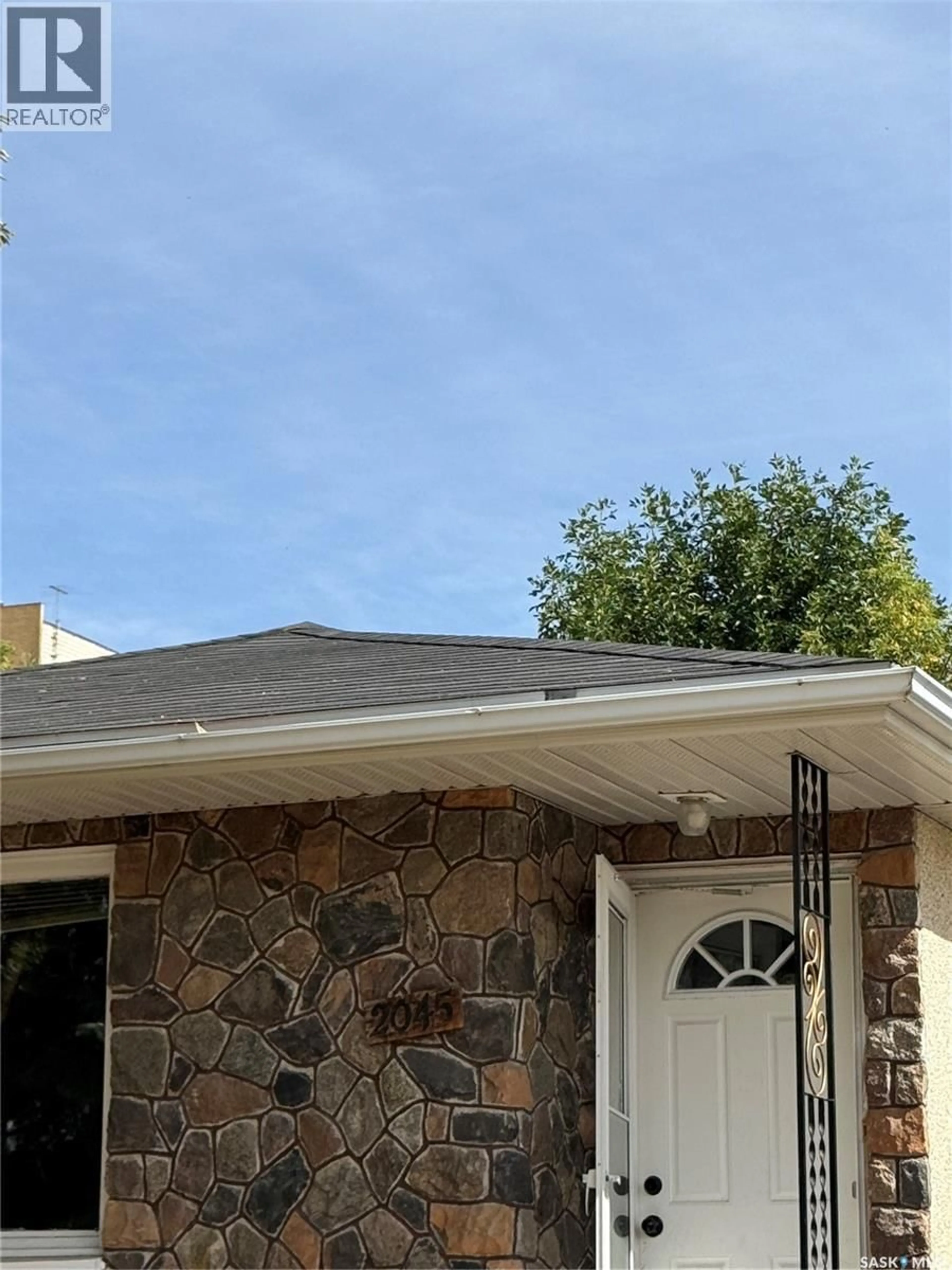 Home with vinyl exterior material, street for 2045 MONTREAL STREET, Regina Saskatchewan S4P1L5