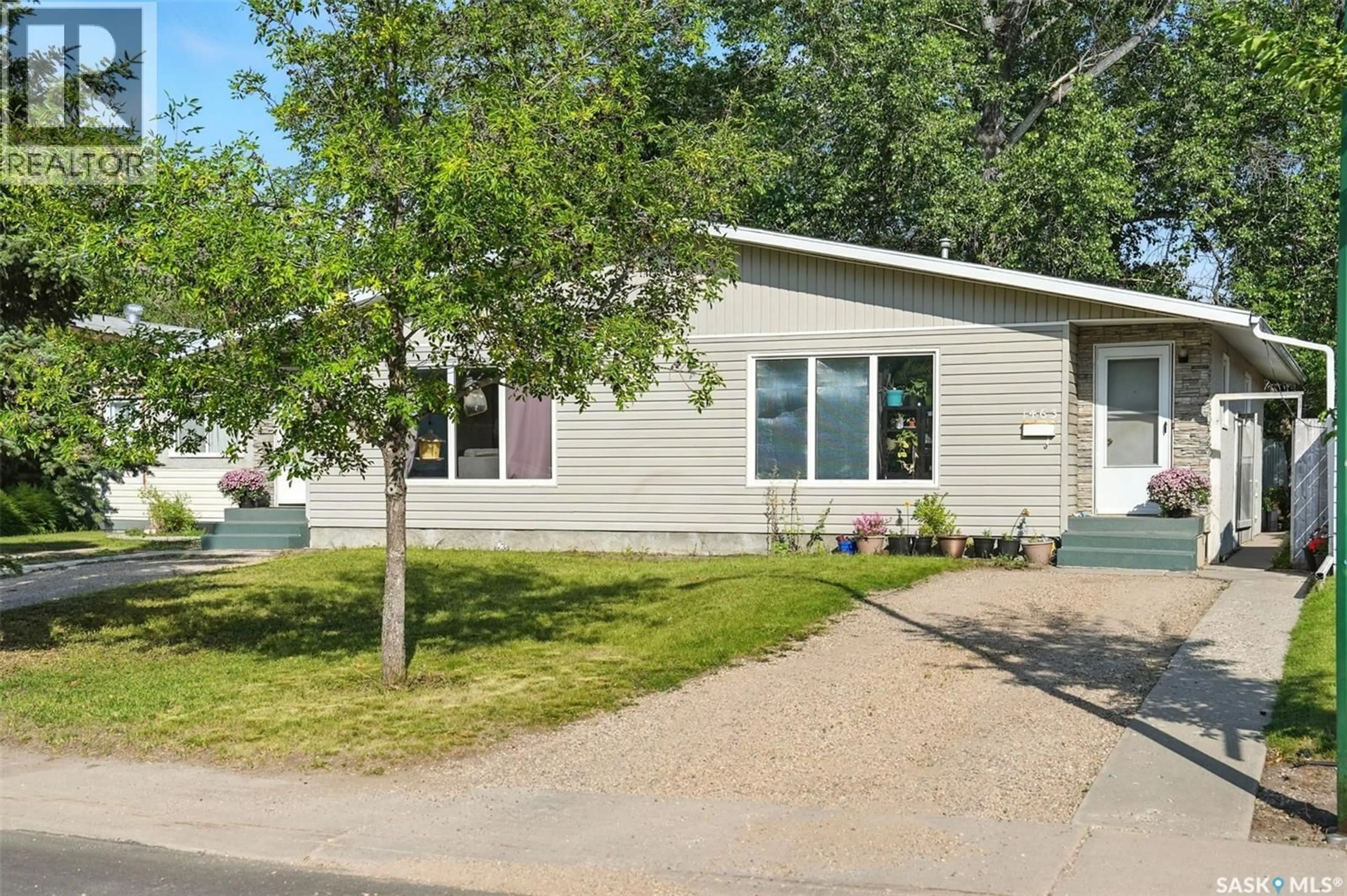 Home with vinyl exterior material, street for 1461-1463 EAST HEIGHTS, Saskatoon Saskatchewan S7J3B2