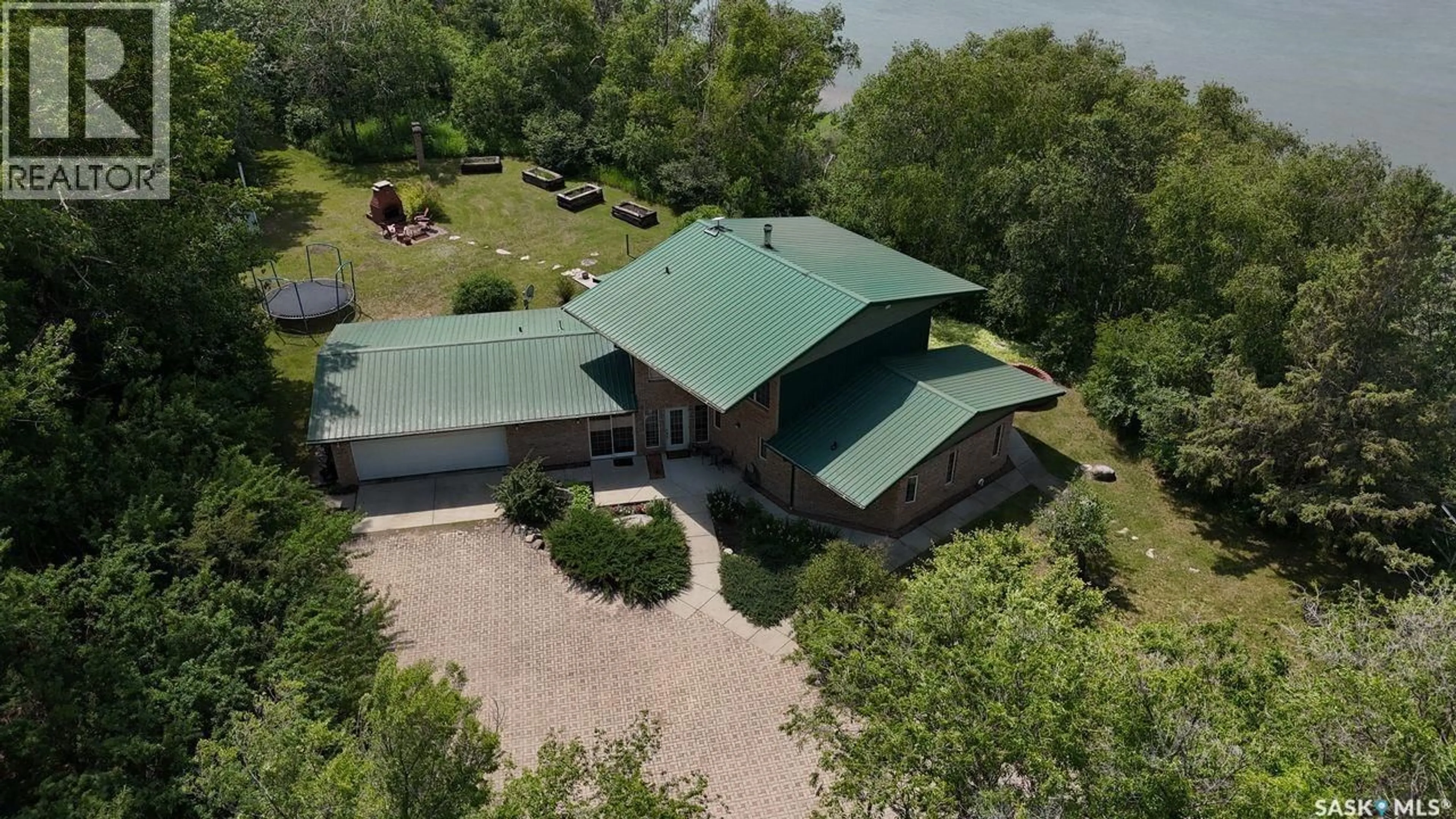 A pic from outside/outdoor area/front of a property/back of a property/a pic from drone, building for DERKSEN RIVERFRONT ACREAGE, St. Louis RM No. 431 Saskatchewan S0K4P0