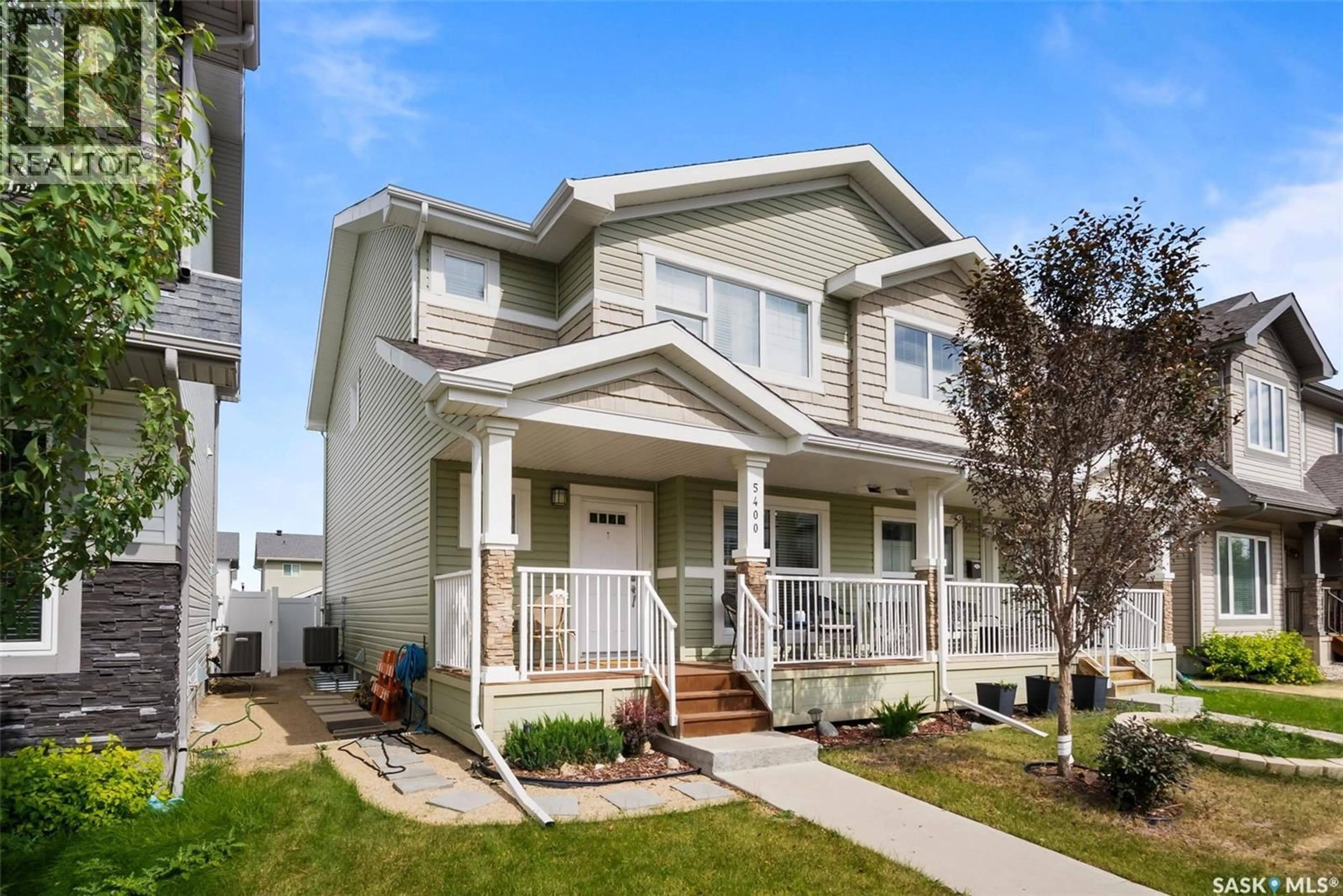 Home with vinyl exterior material, street for E - 5400 GREEN SILVERBERRY DRIVE, Regina Saskatchewan S4V3M4