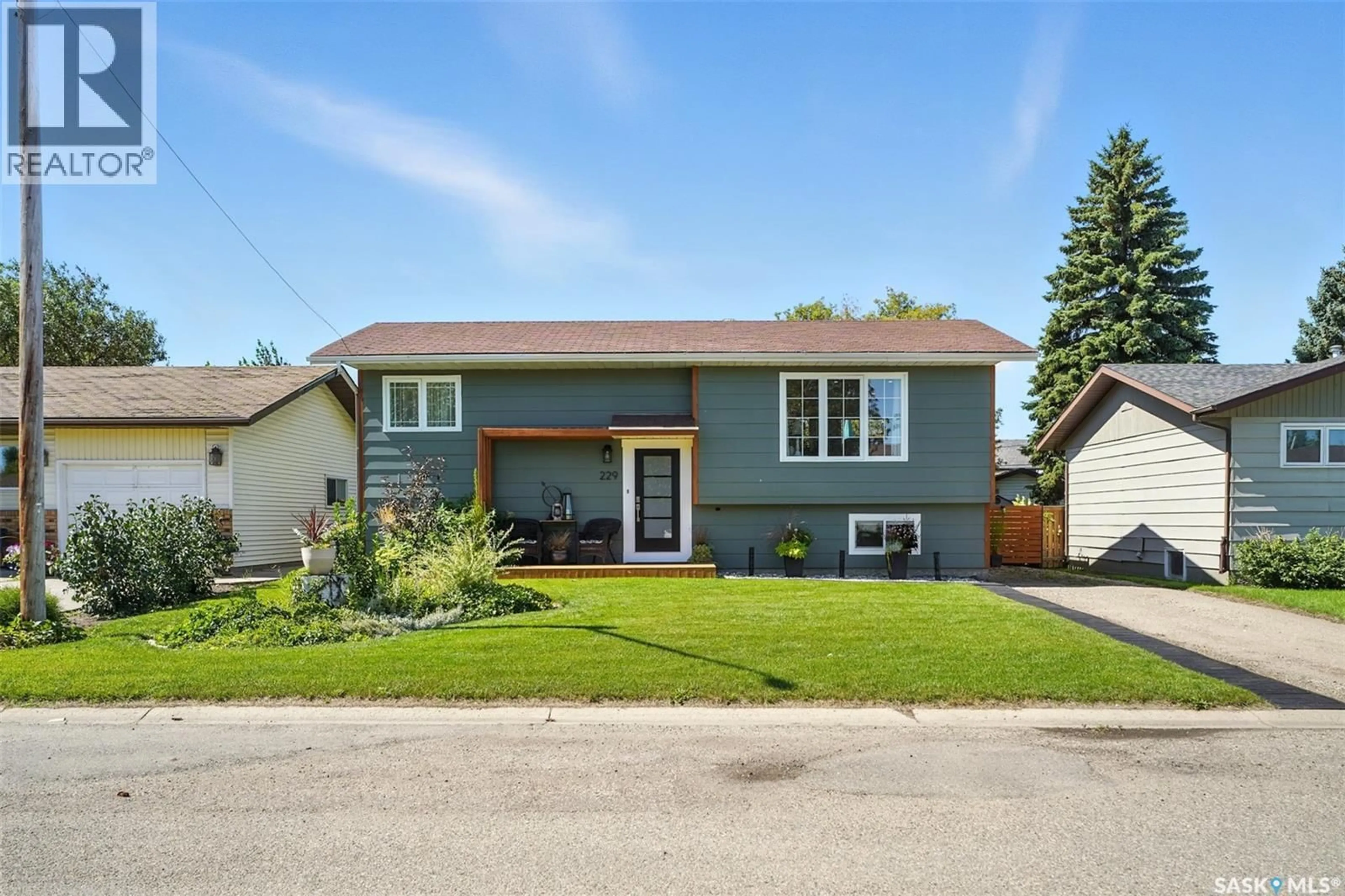 Home with vinyl exterior material, street for 229 2ND STREET, Vanscoy Saskatchewan S0L3J0