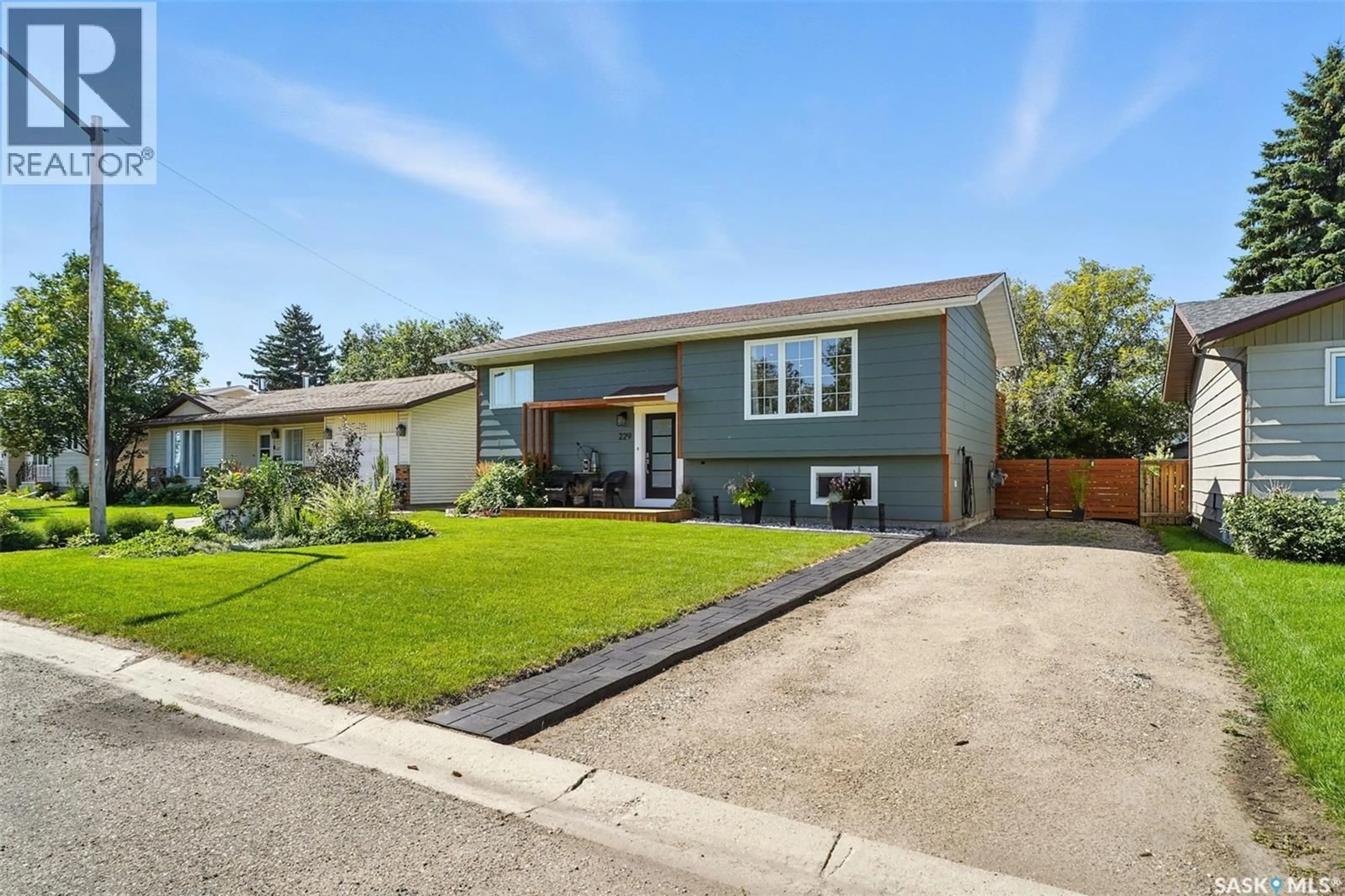 Home with vinyl exterior material, street for 229 2ND STREET, Vanscoy Saskatchewan S0L3J0