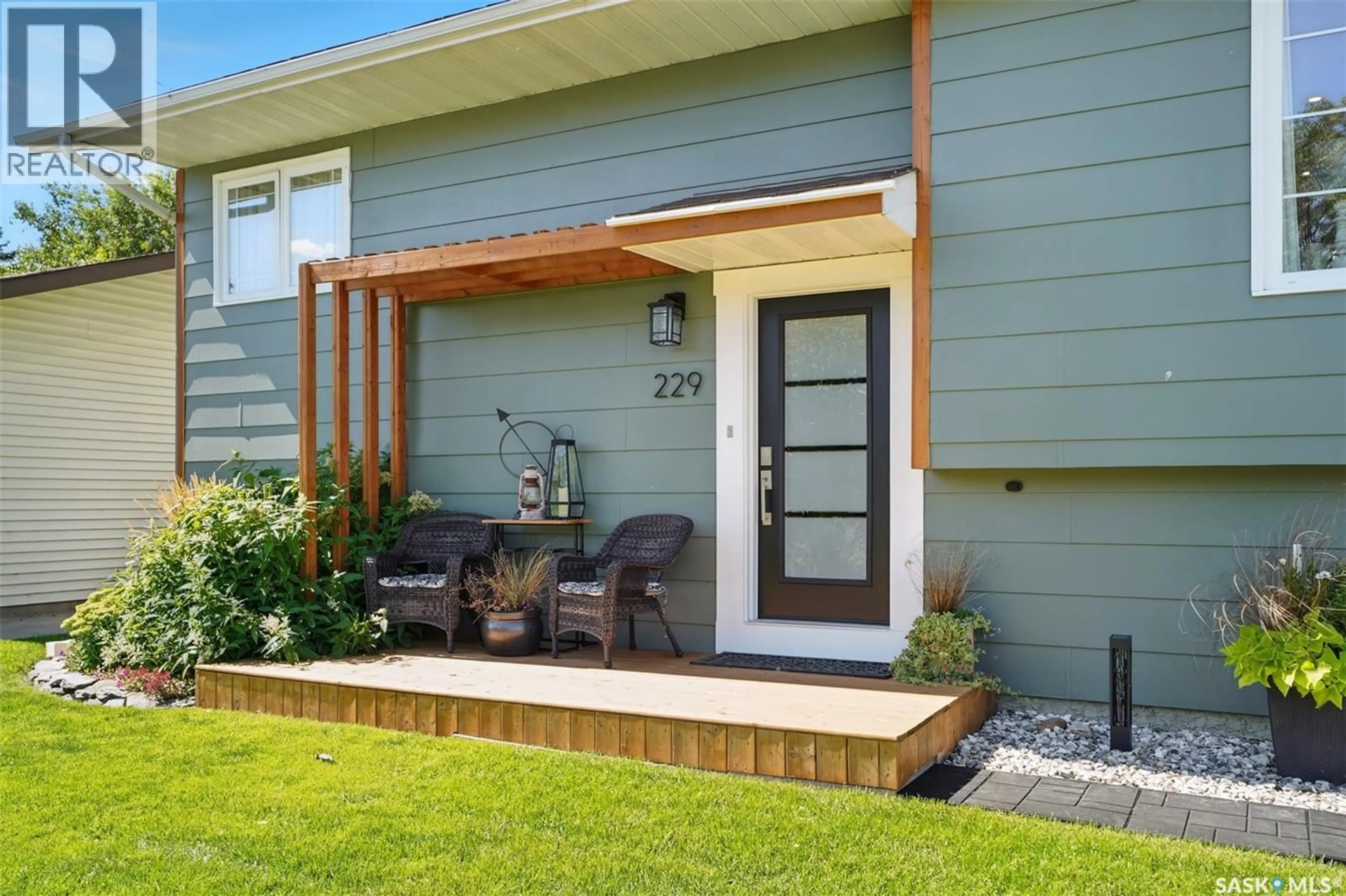 Home with vinyl exterior material, street for 229 2ND STREET, Vanscoy Saskatchewan S0L3J0