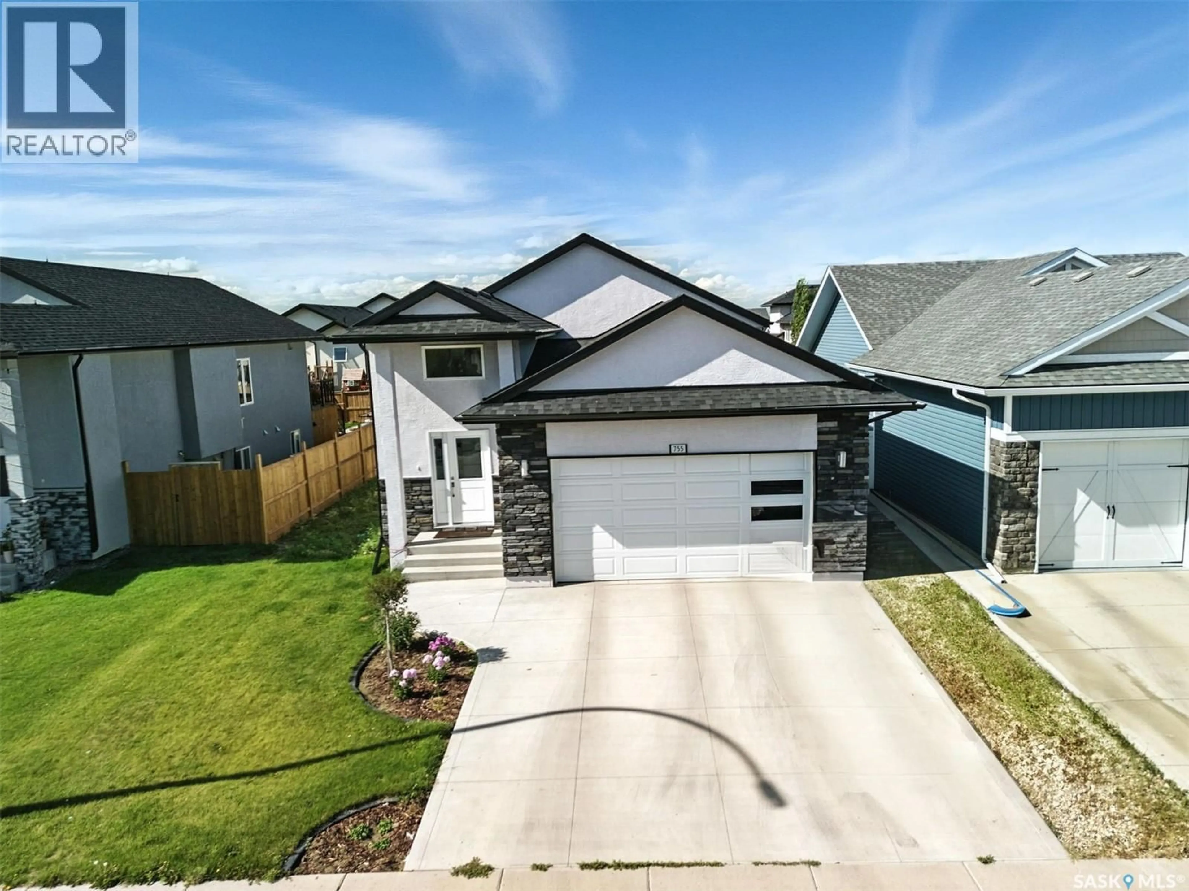 A pic from outside/outdoor area/front of a property/back of a property/a pic from drone, street for 755 LABINE COURT, Saskatoon Saskatchewan S7L6C8