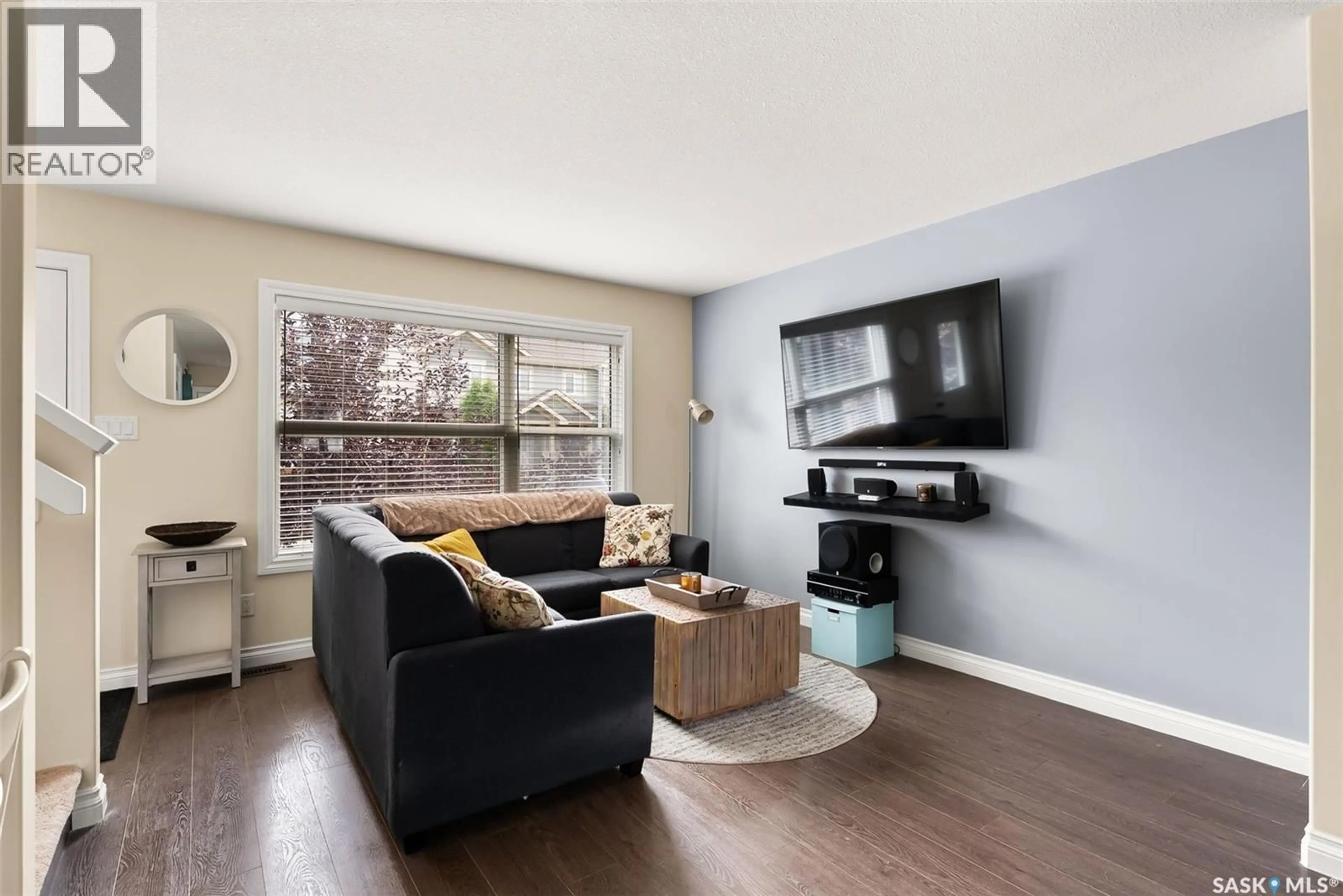Living room with furniture, wood/laminate floor for 2846 ROCHDALE BOULEVARD, Regina Saskatchewan S4X0M6