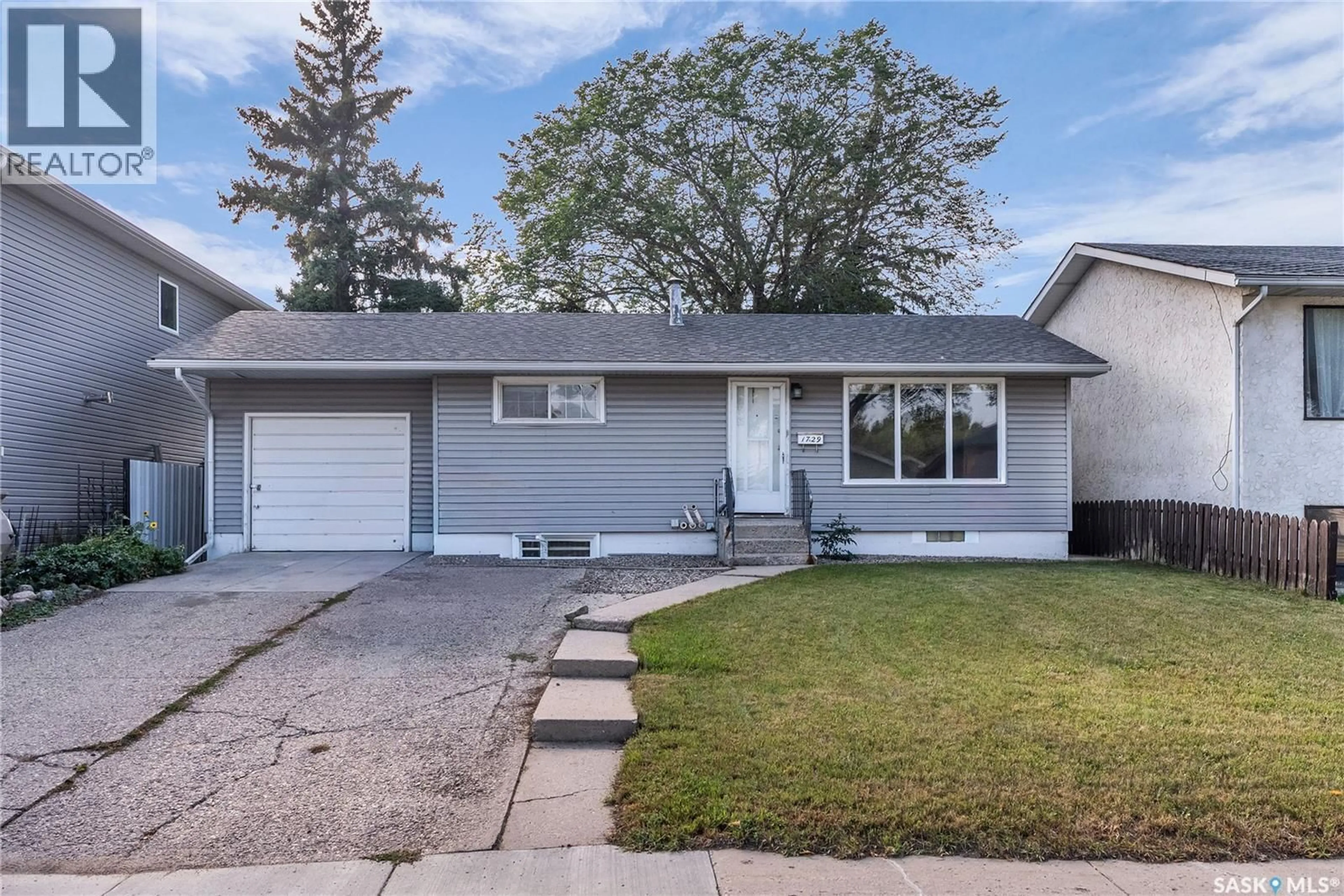 Home with vinyl exterior material, street for 1729 C AVENUE, Saskatoon Saskatchewan S7L1L6