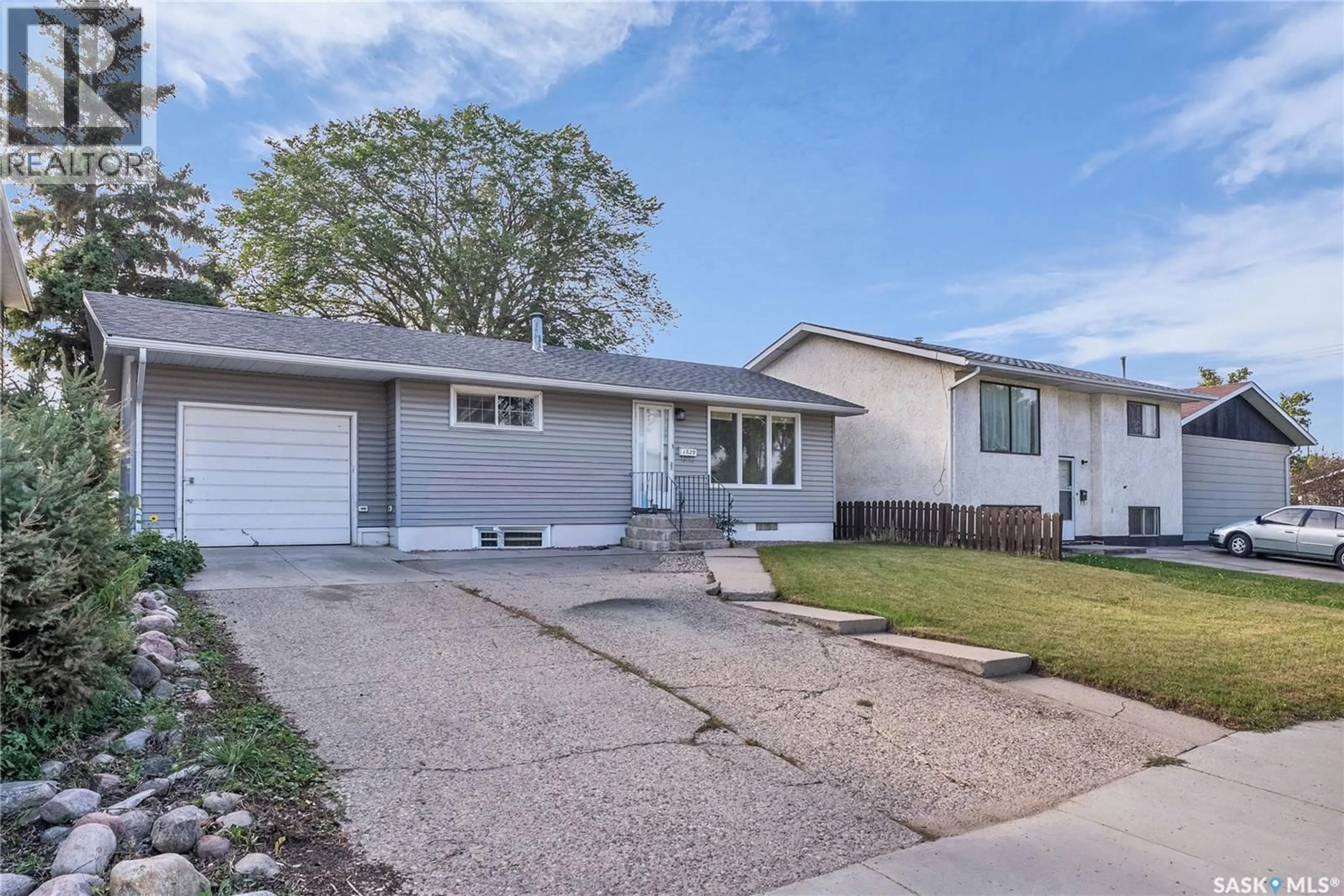 Home with vinyl exterior material, street for 1729 C AVENUE, Saskatoon Saskatchewan S7L1L6
