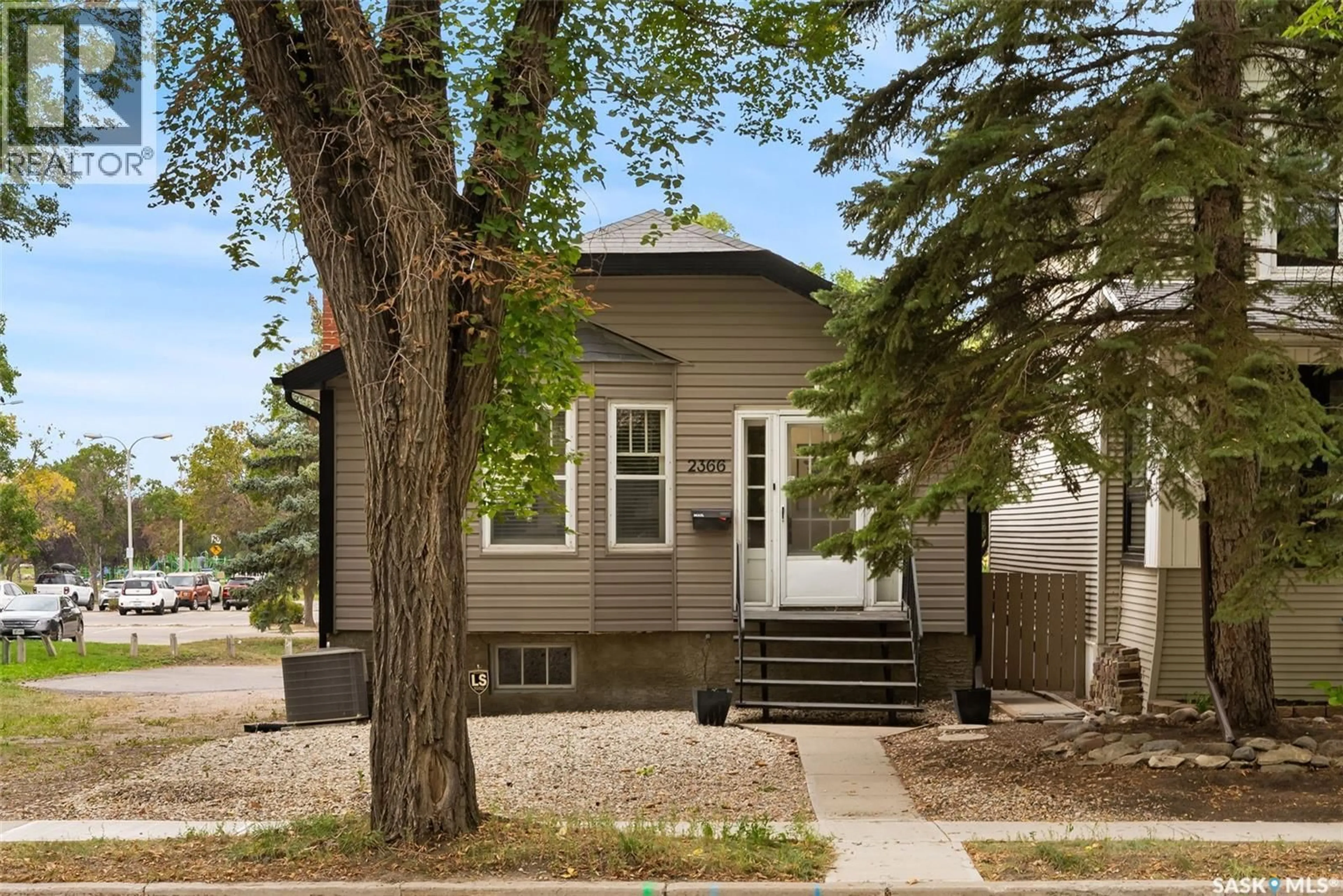 Home with vinyl exterior material, street for 2366 ELPHINSTONE STREET, Regina Saskatchewan S4S0J7