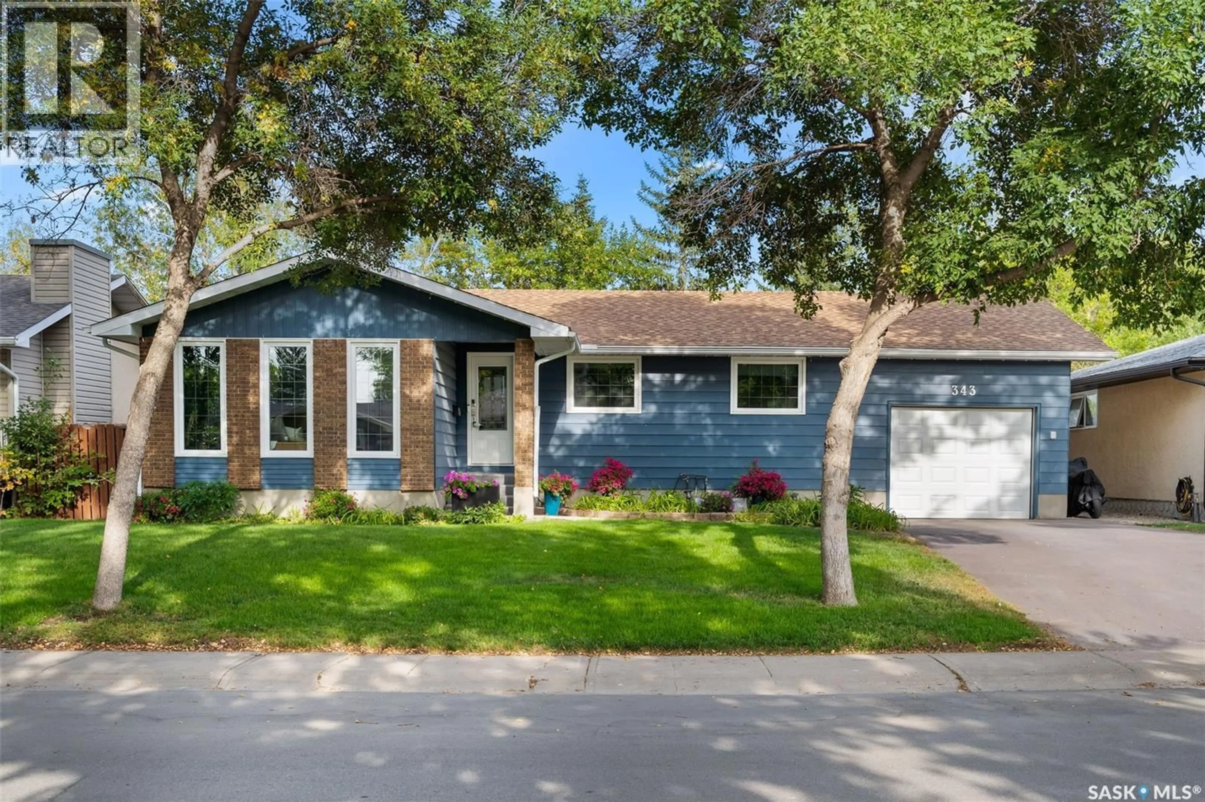 Home with vinyl exterior material, street for 343 FAIRVIEW ROAD, Regina Saskatchewan S4R6W2