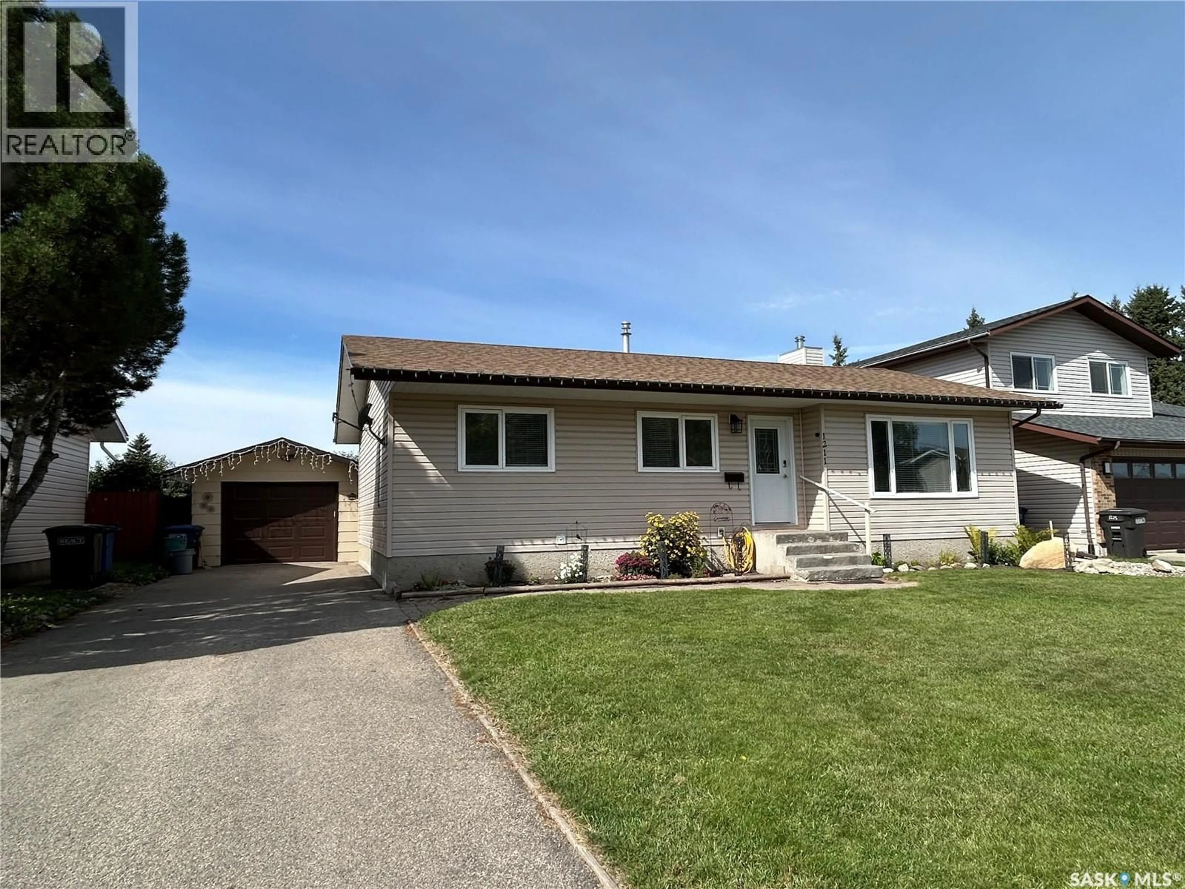 Home with vinyl exterior material, street for 1211 13TH STREET, Humboldt Saskatchewan S0K2A0