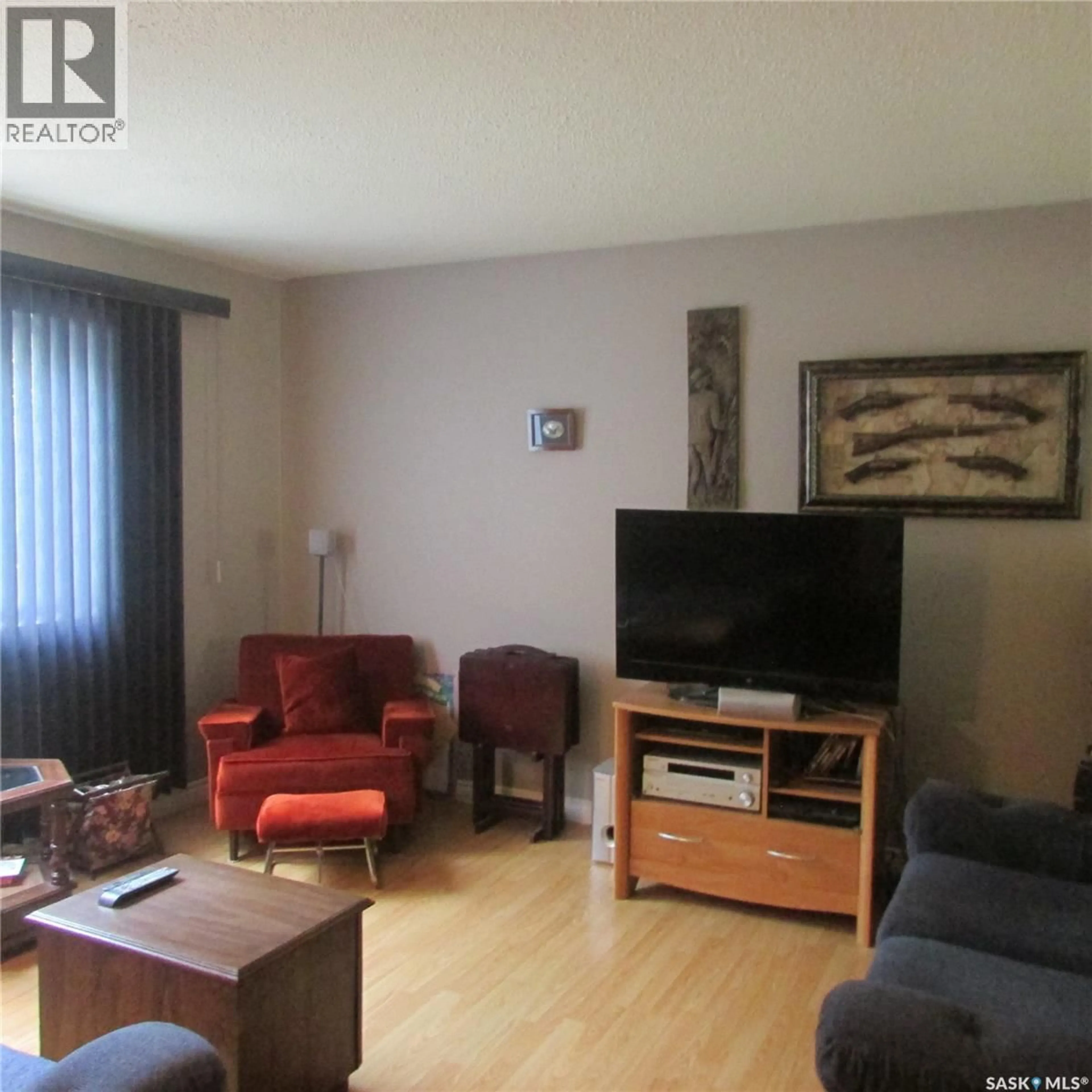 Living room with furniture, wood/laminate floor for 343 BRUCE STREET, Regina Saskatchewan S4R5H2