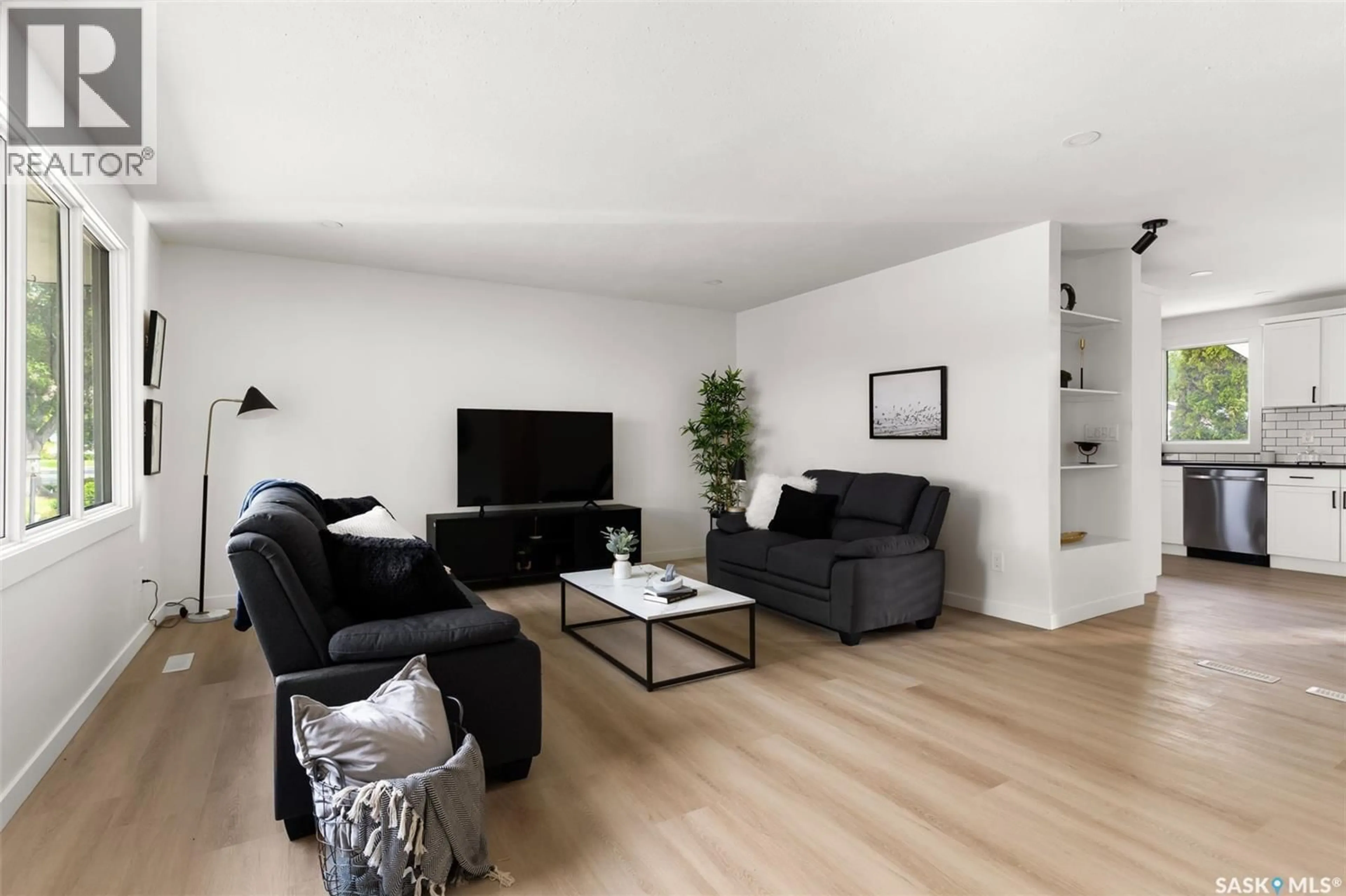 Living room with furniture, wood/laminate floor for 103 ELMVIEW ROAD, Regina Saskatchewan S4R0B5