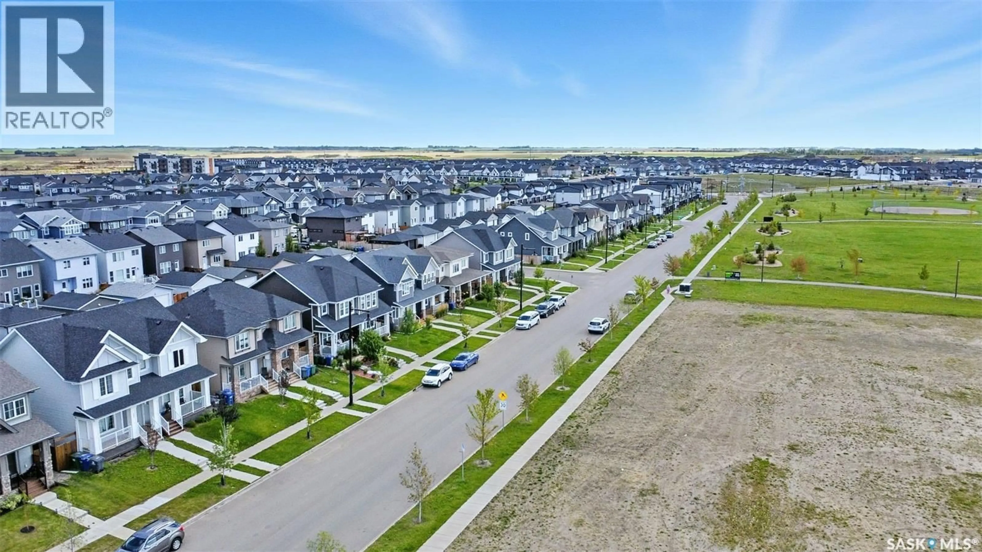 A pic from outside/outdoor area/front of a property/back of a property/a pic from drone, street for 349 BRIGHTON BOULEVARD, Saskatoon Saskatchewan S7V0R5