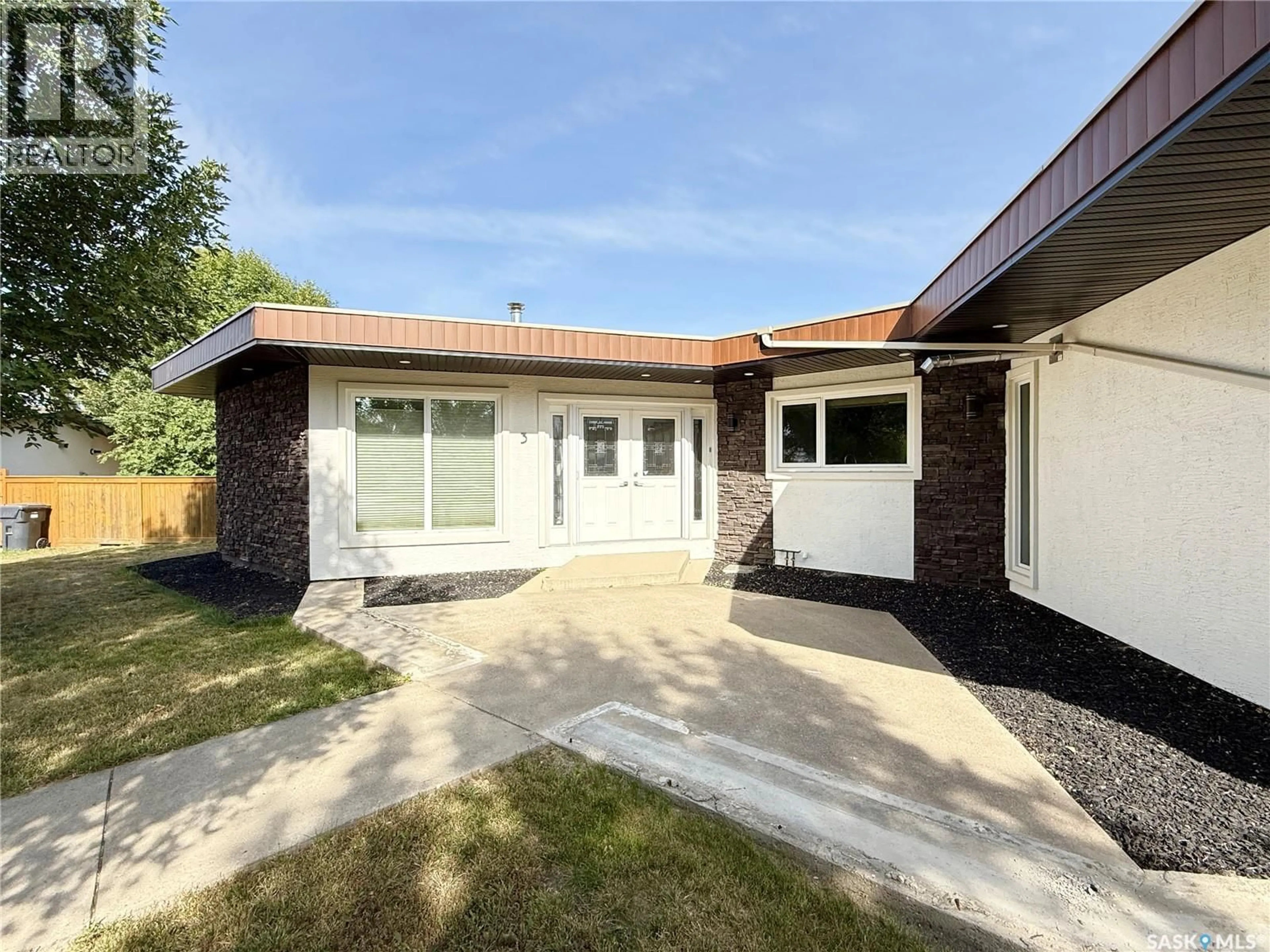 Home with vinyl exterior material, street for 3 MCLELLAND BAY, Weyburn Saskatchewan S4H2V3