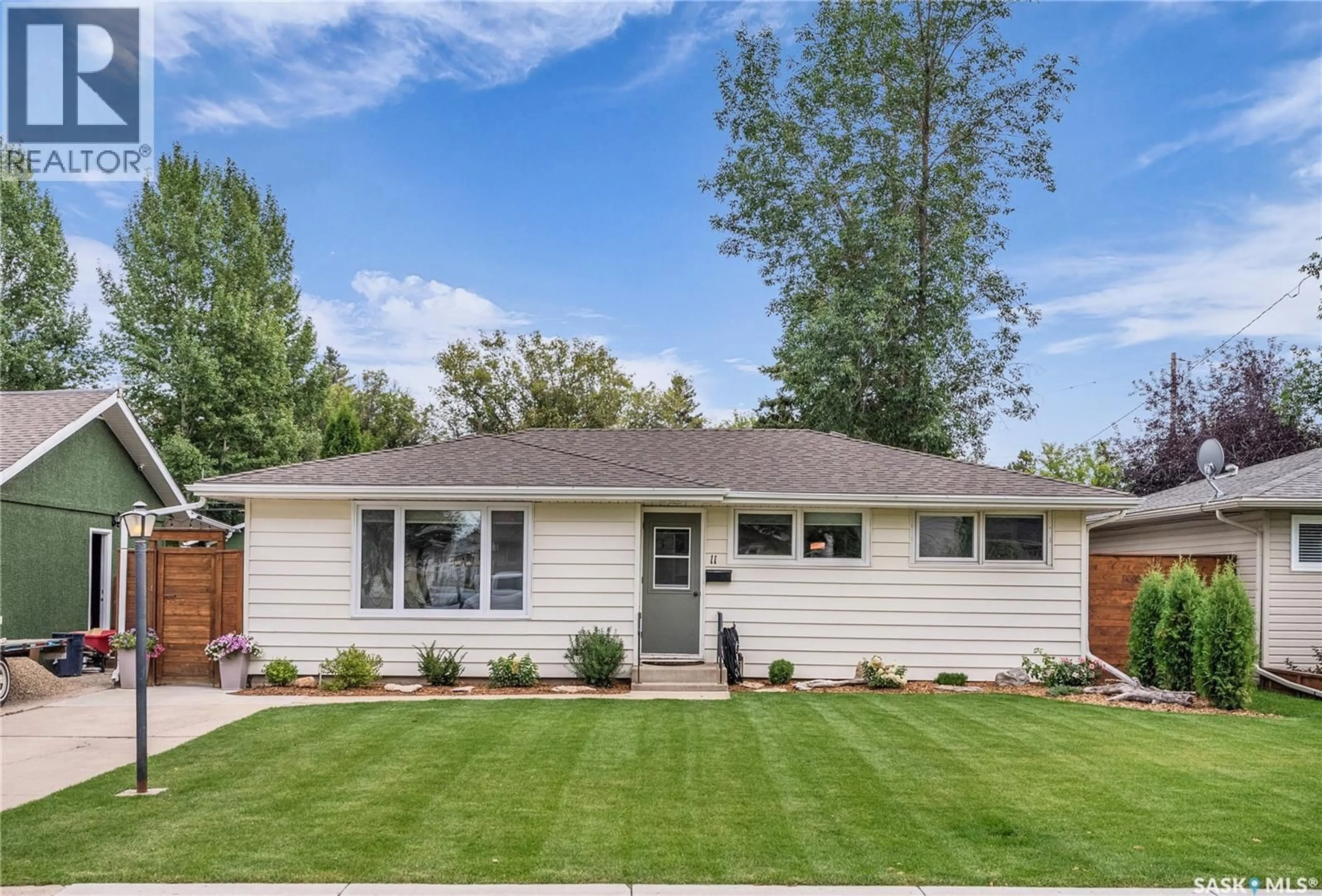 Home with vinyl exterior material, street for 11 GROSVENOR CRESCENT, Saskatoon Saskatchewan S7J2S1
