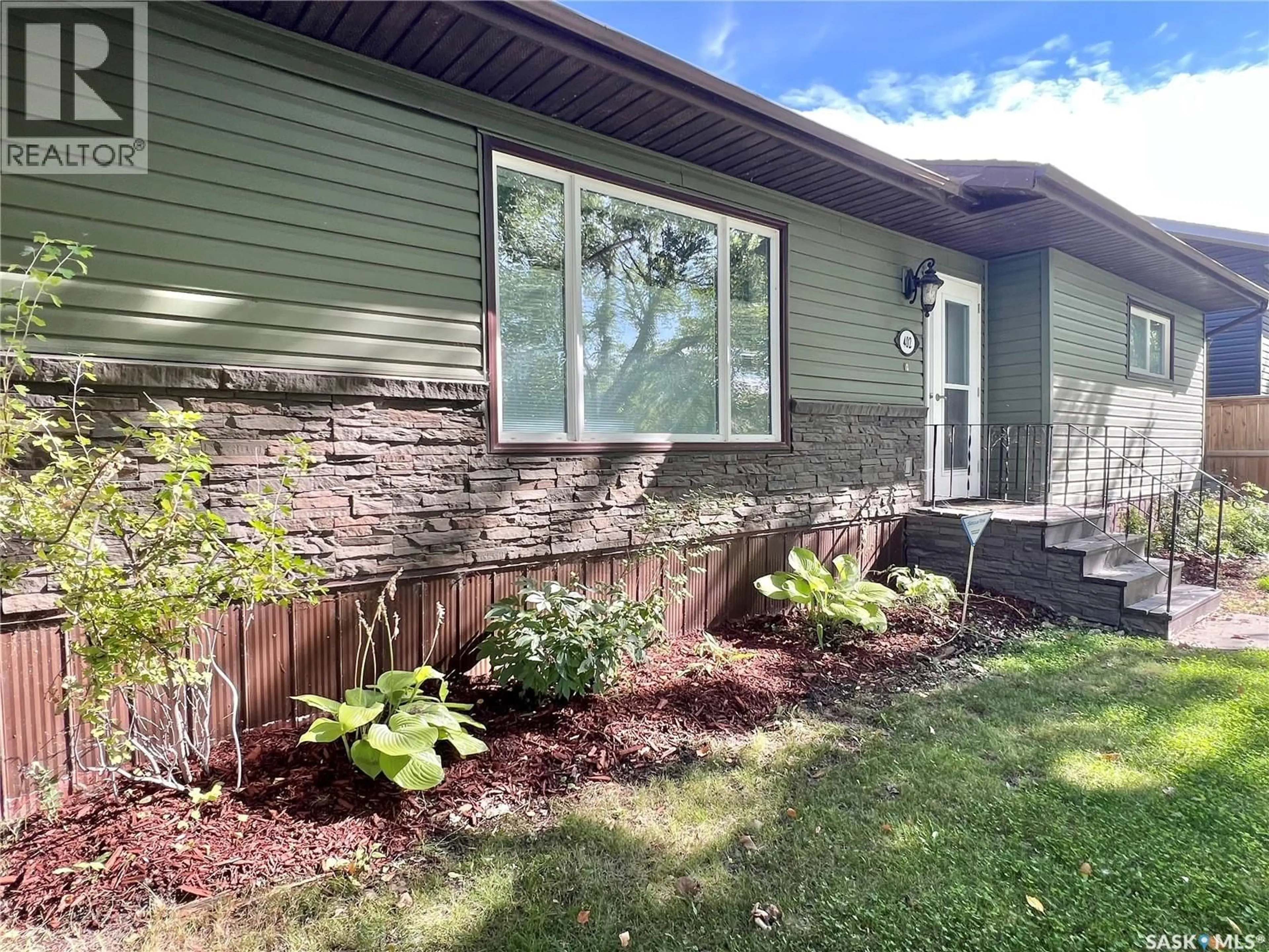 Home with brick exterior material, street for E - 402 CRAWFORD AVENUE, Melfort Saskatchewan S0E1A0