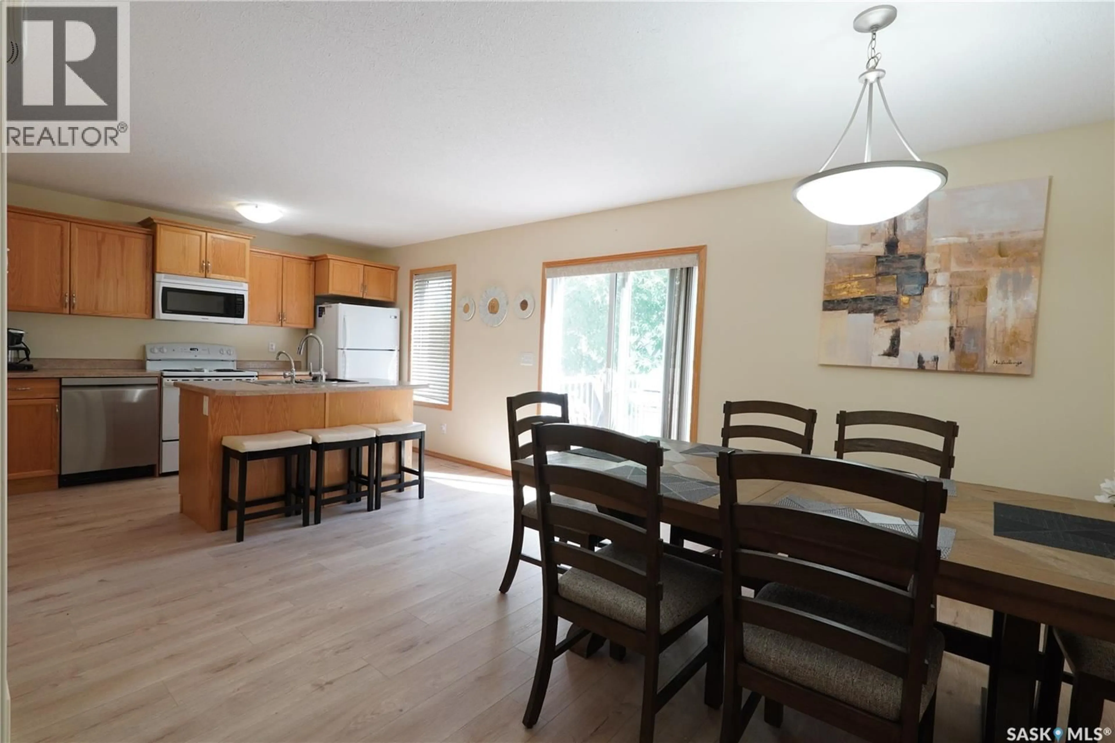 Open concept kitchen, wood/laminate floor for 214 MOUNT ROYAL PLACE, Regina Saskatchewan S4T7X9