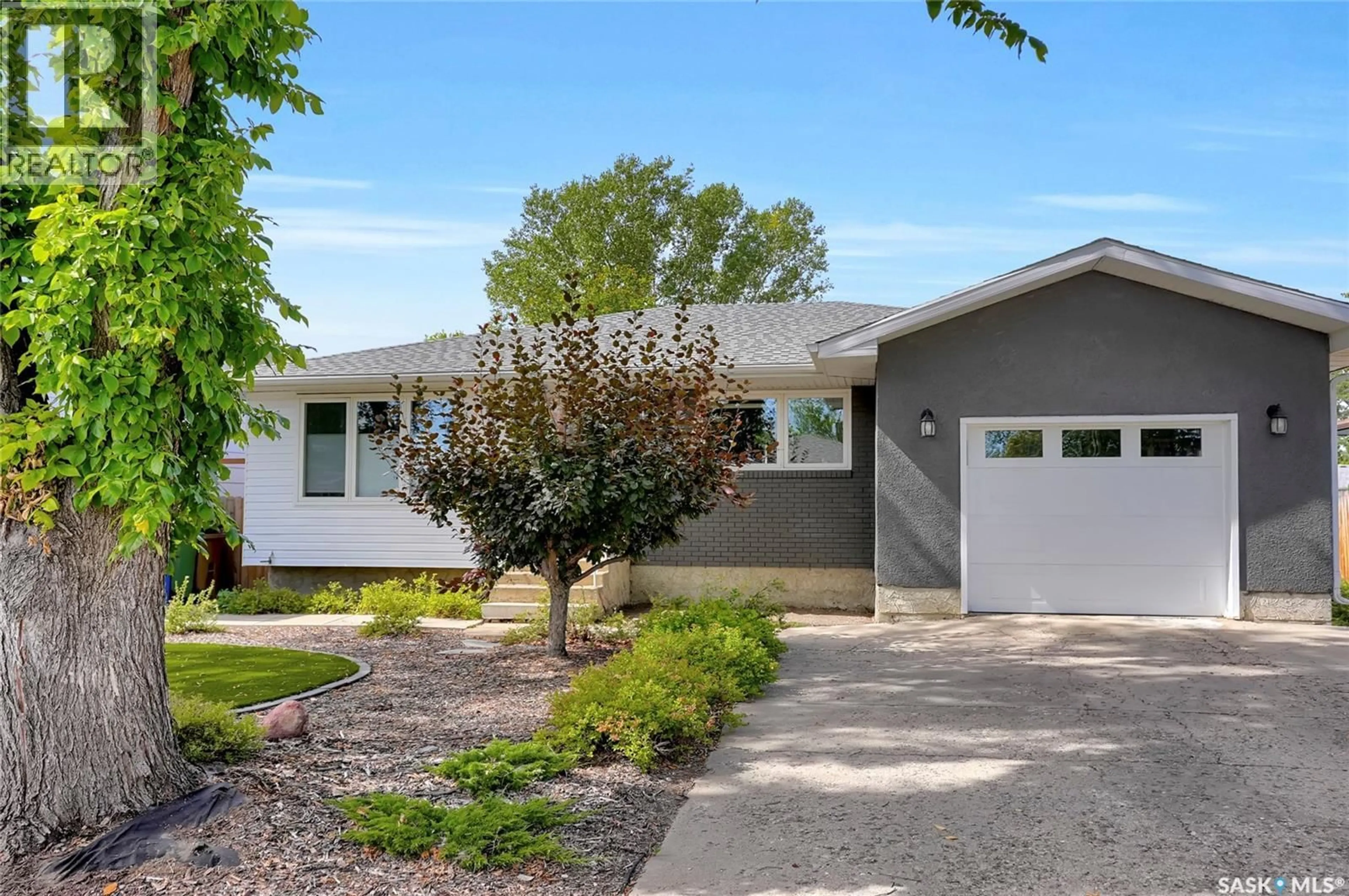 Home with vinyl exterior material, street for 66 KENNEDY CRESCENT, Regina Saskatchewan S4R6G4