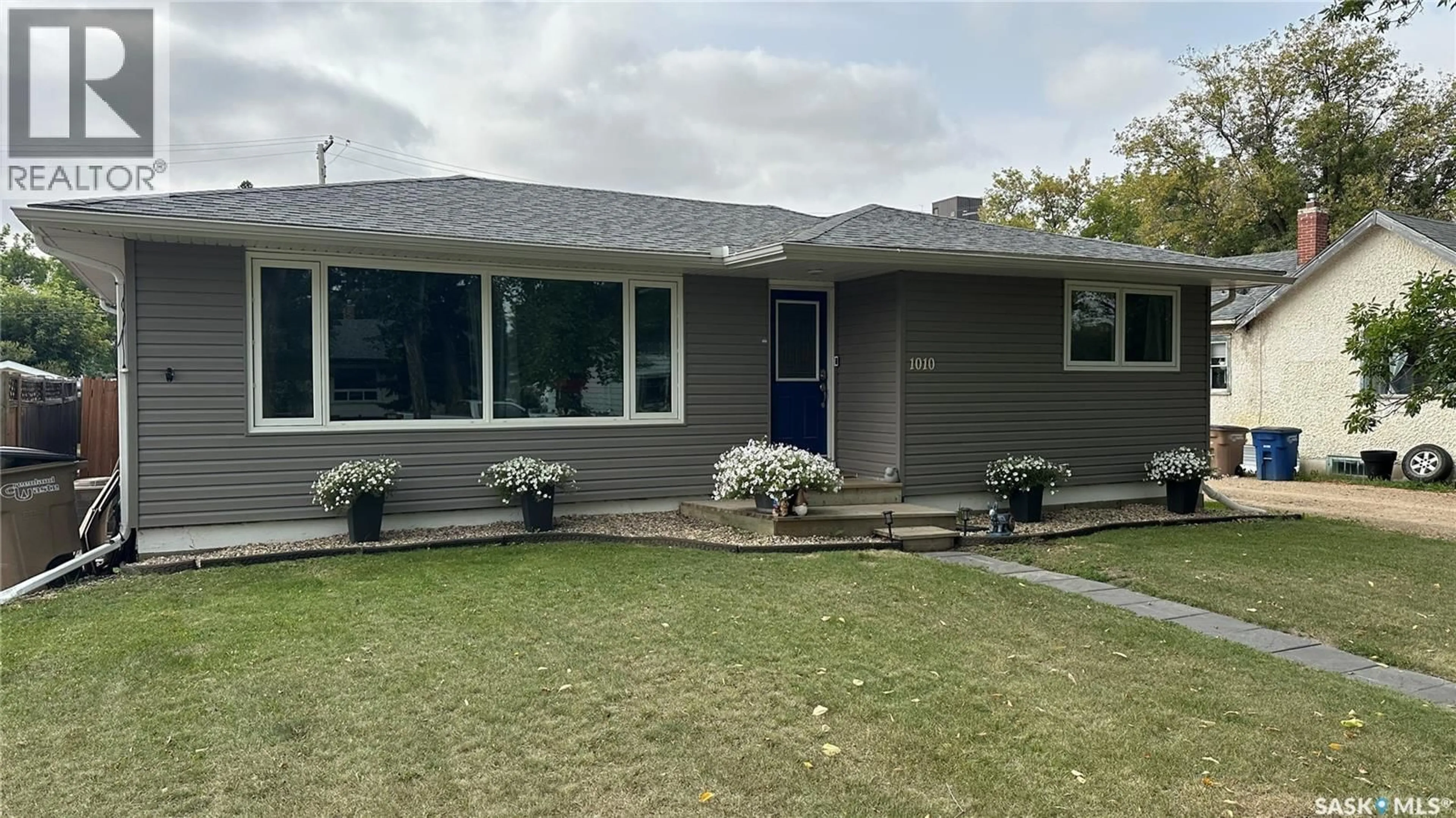 Home with vinyl exterior material, street for 1010 105TH AVENUE, Tisdale Saskatchewan S0E1T0