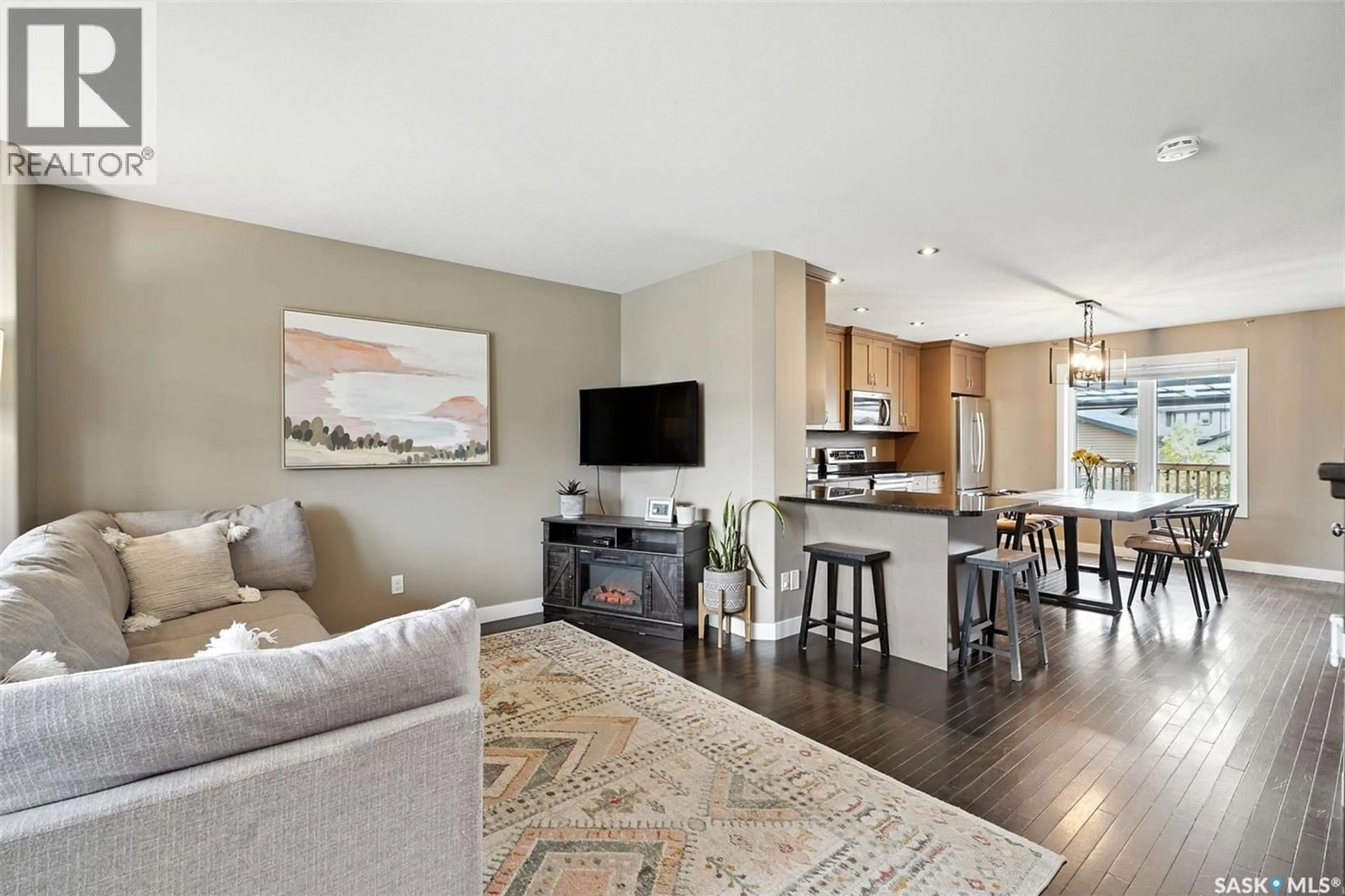 Open concept kitchen, wood/laminate floor for 126 LANGLOIS WAY, Saskatoon Saskatchewan S7T0N6