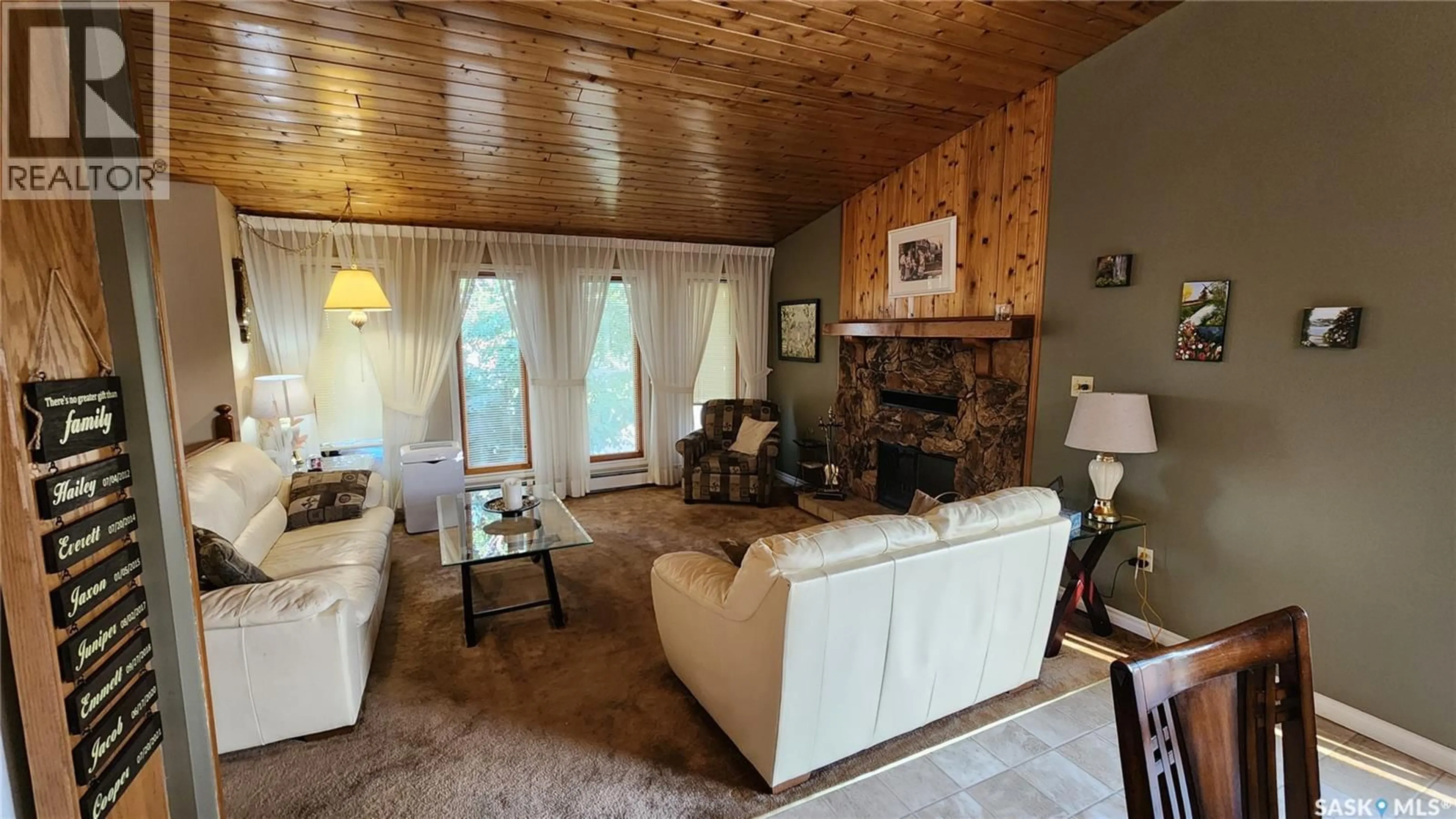Living room with furniture, wood/laminate floor for 91 18TH STREET, Battleford Saskatchewan S0M0E0
