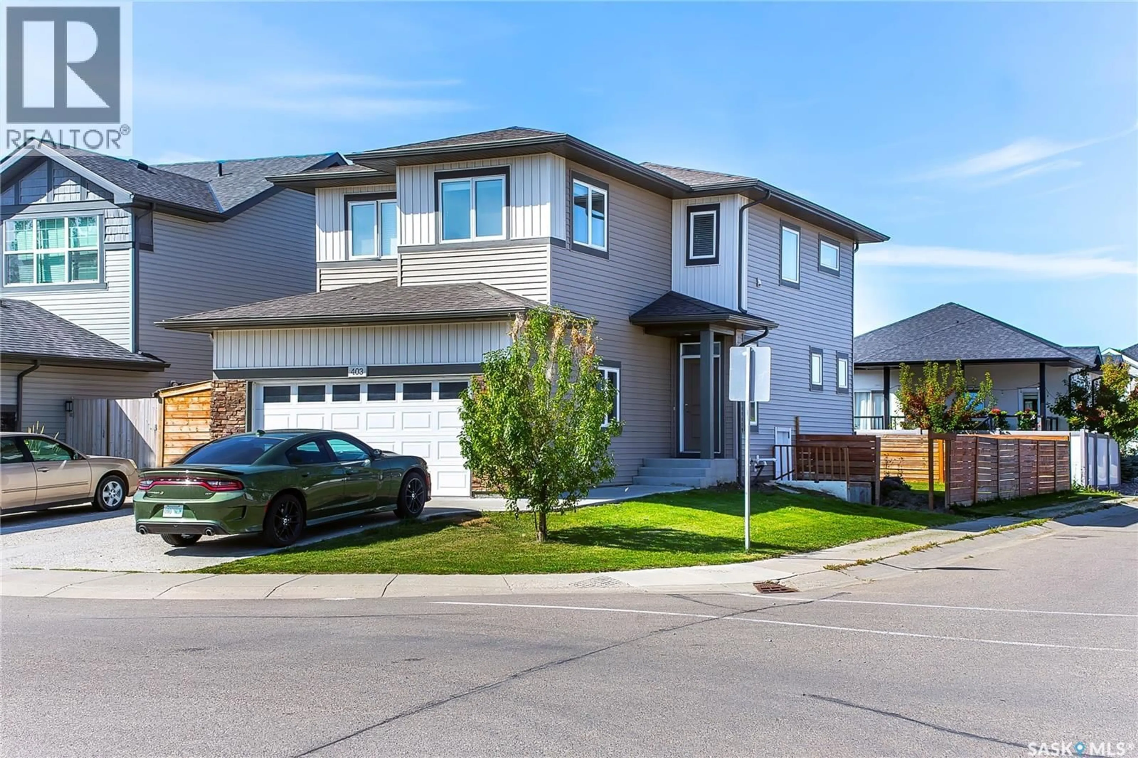 Home with vinyl exterior material, street for 403 CHILDERS WAY, Saskatoon Saskatchewan S7L4P2