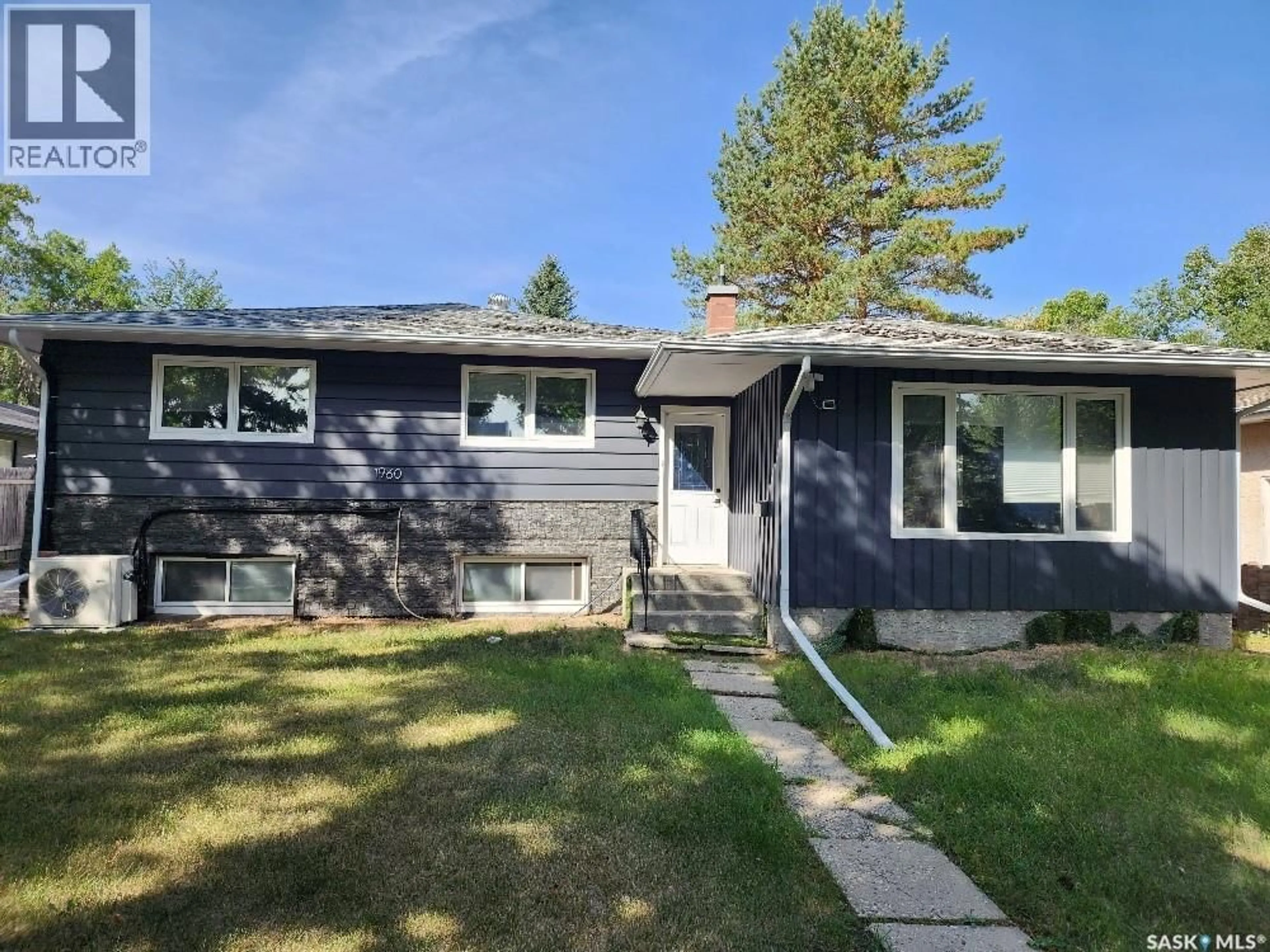 Home with vinyl exterior material, street for 1960 COWAN CRESCENT, Regina Saskatchewan S4S4C6