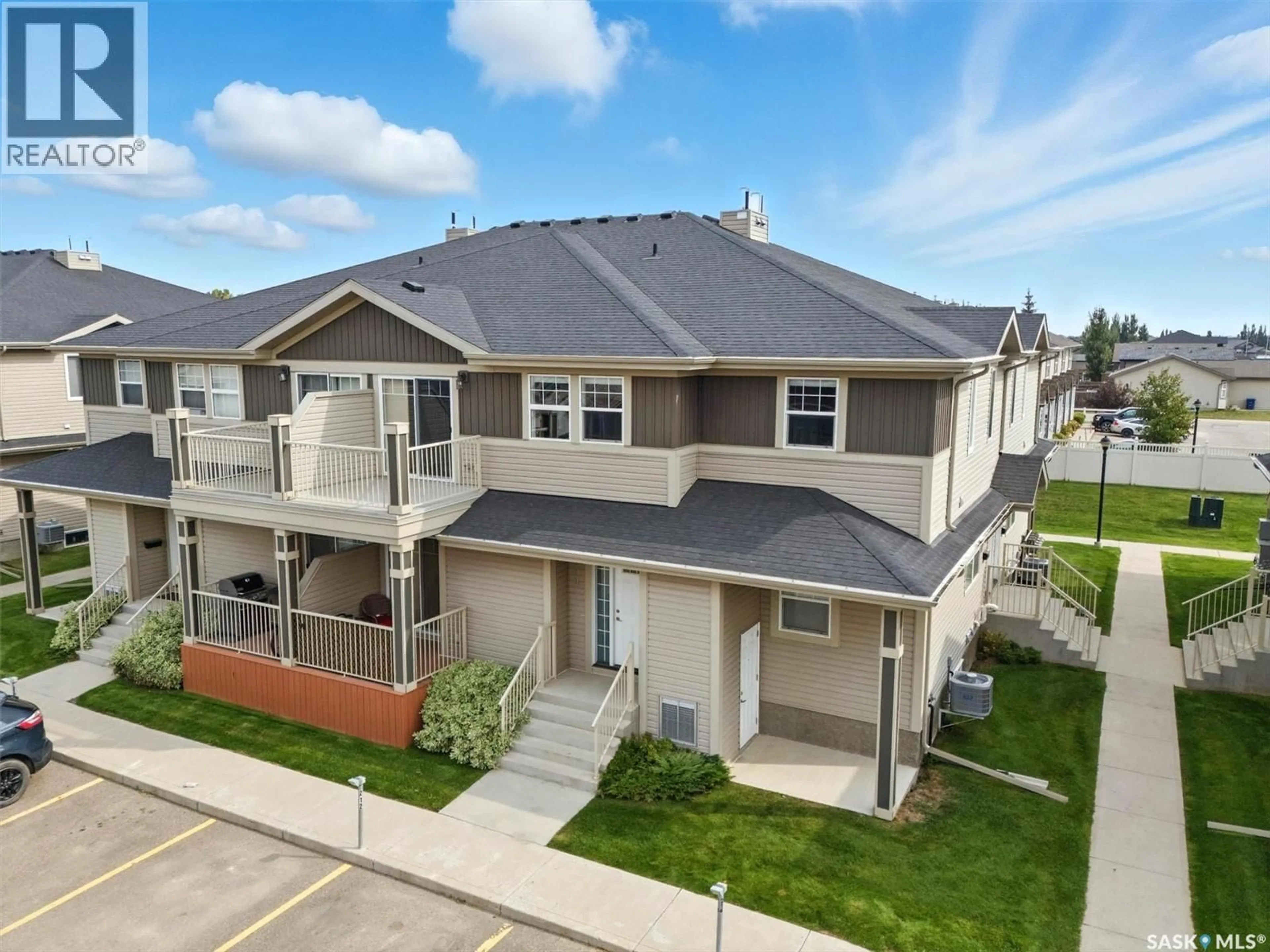 A pic from outside/outdoor area/front of a property/back of a property/a pic from drone, street for 100 - 213 CHAPARRAL BOULEVARD, Martensville Saskatchewan S0K0A2
