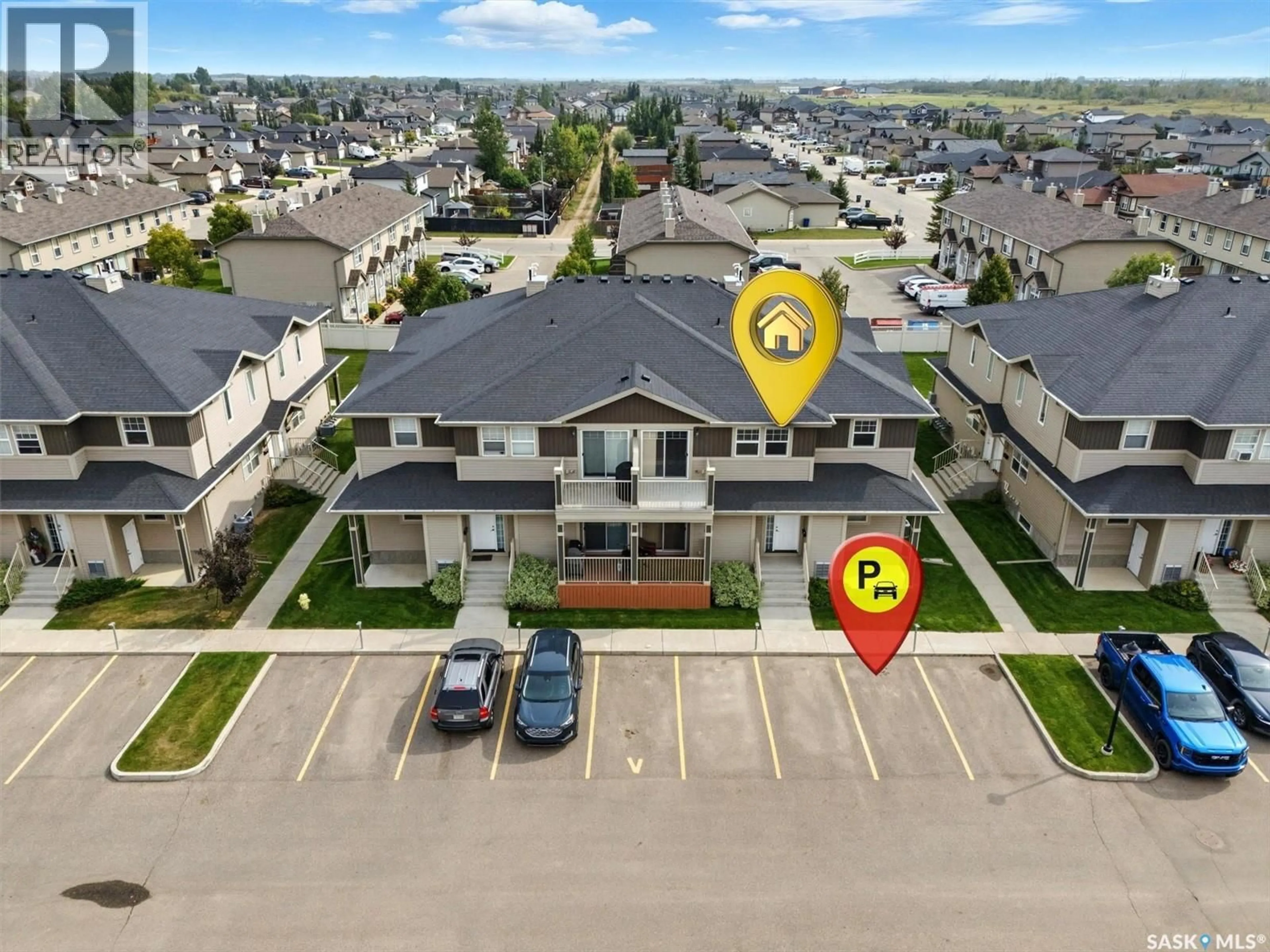 A pic from outside/outdoor area/front of a property/back of a property/a pic from drone, street for 100 - 213 CHAPARRAL BOULEVARD, Martensville Saskatchewan S0K0A2
