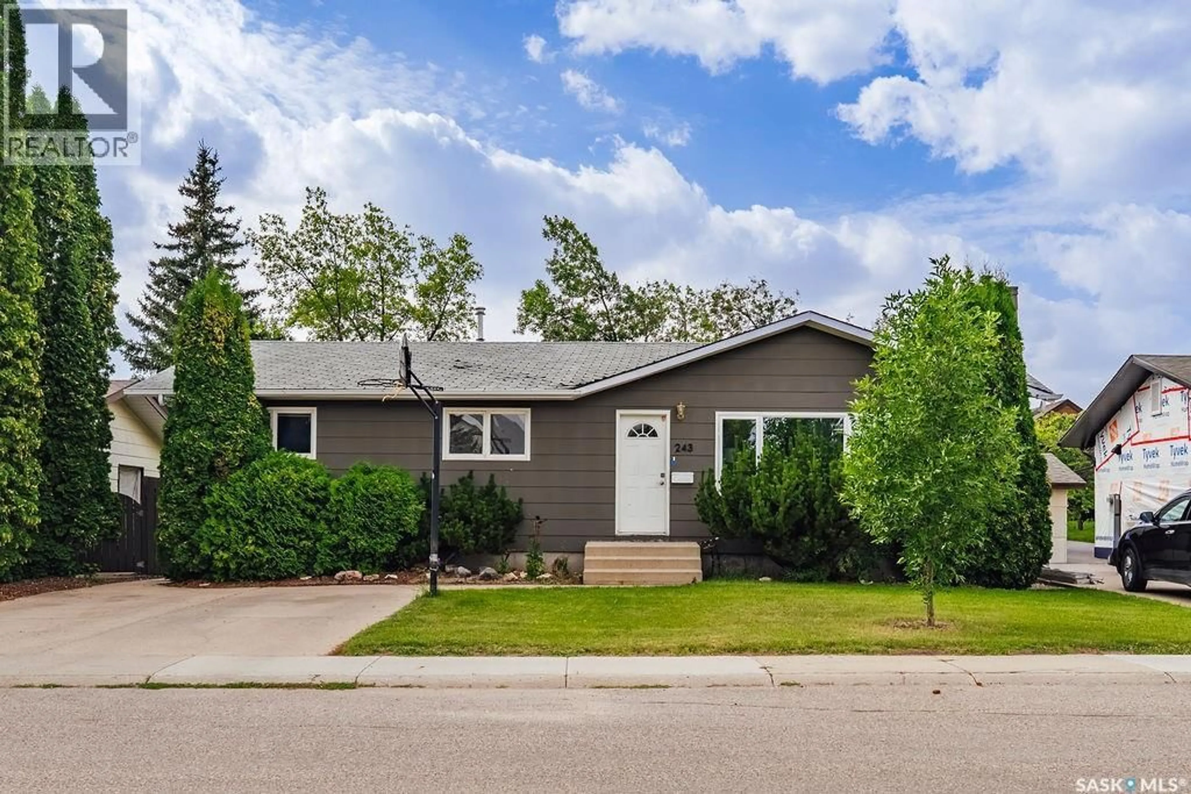 Home with vinyl exterior material, street for 243 ROBORECKI CRESCENT, Saskatoon Saskatchewan S7K5L1