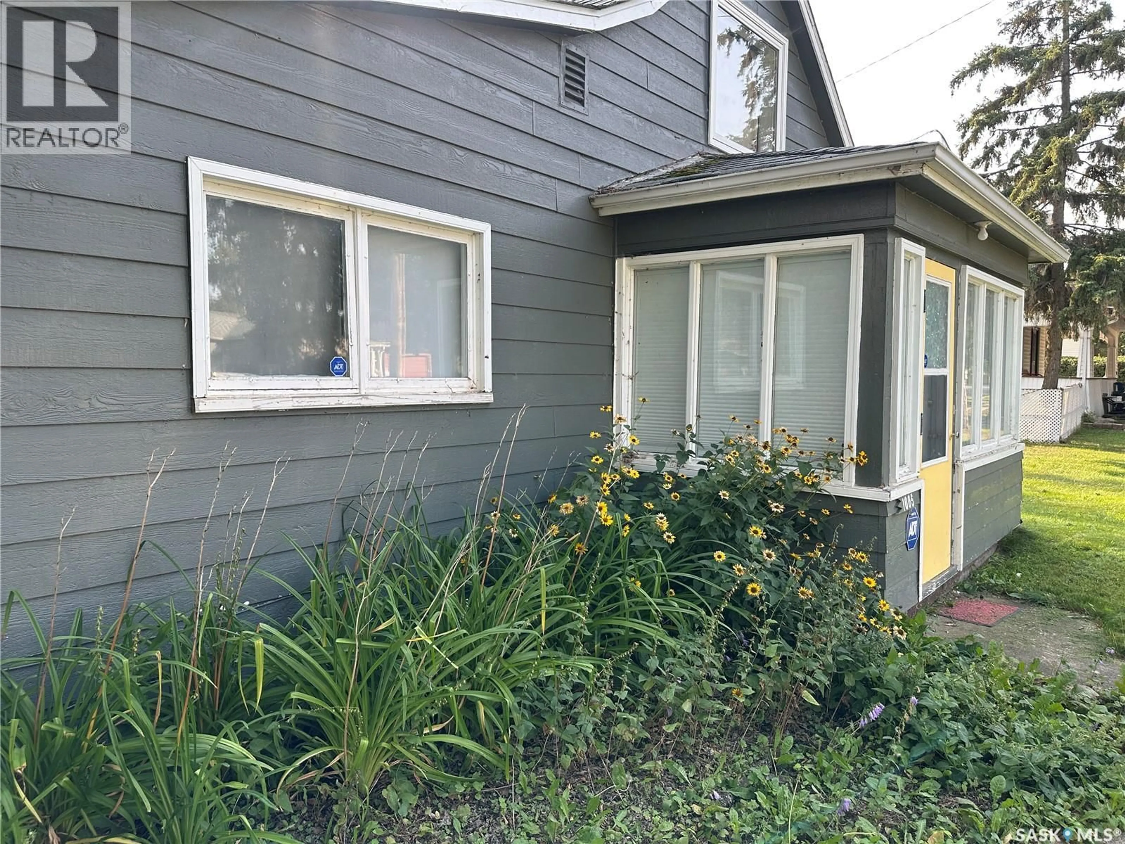 Home with vinyl exterior material, street for 1005 9TH STREET, Rosthern Saskatchewan S0K3R0