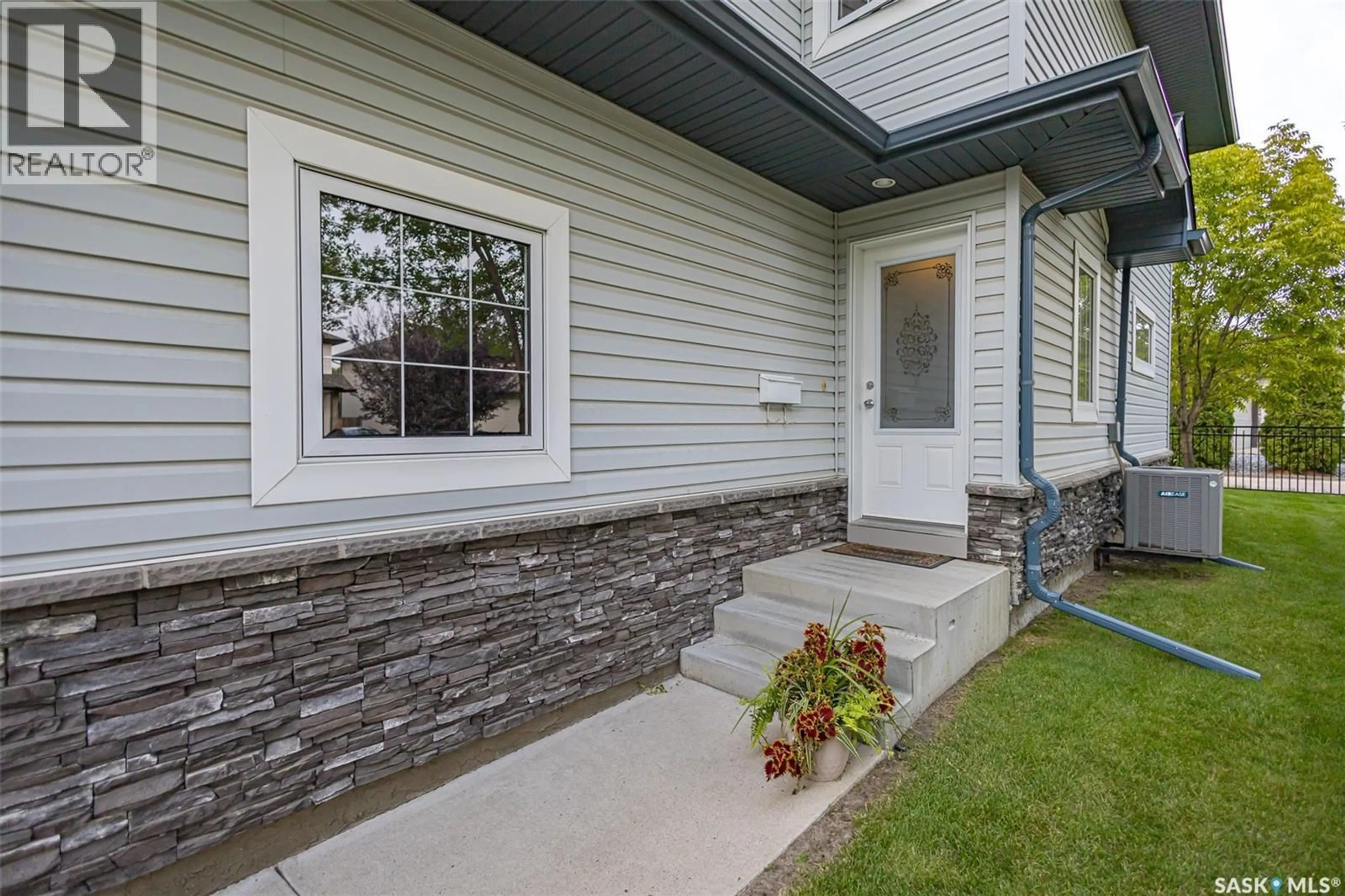 Home with vinyl exterior material, street for 110 - 6 DULMAGE CRESCENT, Saskatoon Saskatchewan S7T0C7