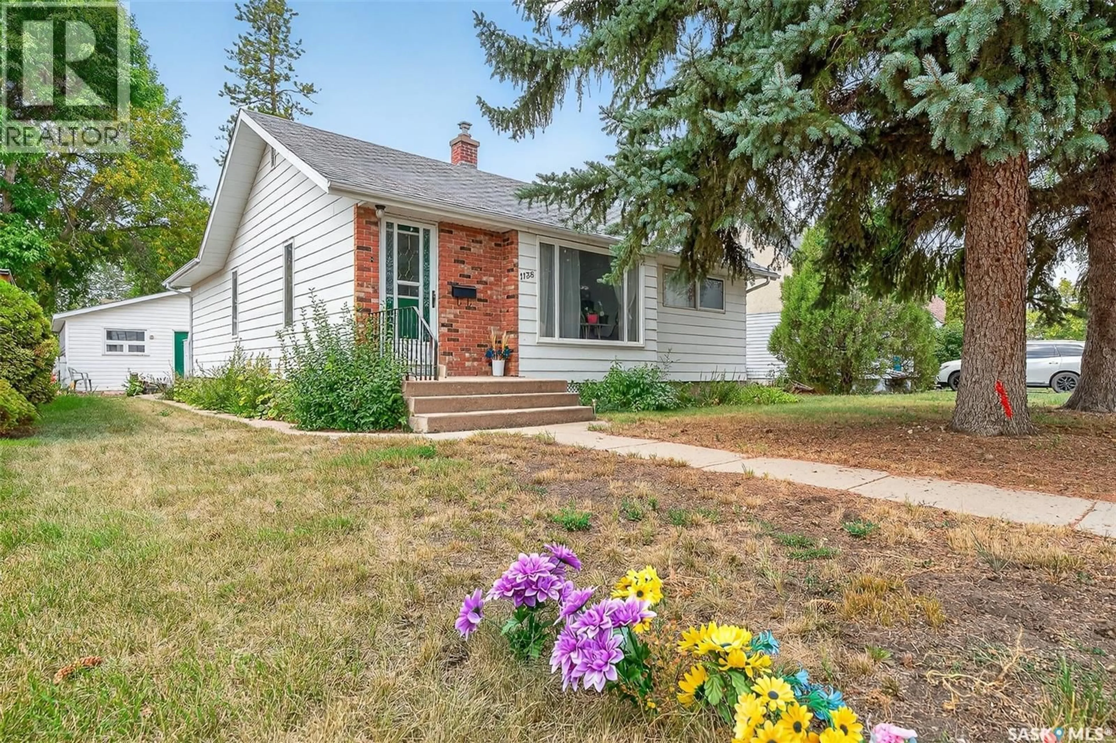 Home with vinyl exterior material, street for 1138 7TH AVENUE, Moose Jaw Saskatchewan S6H4C5