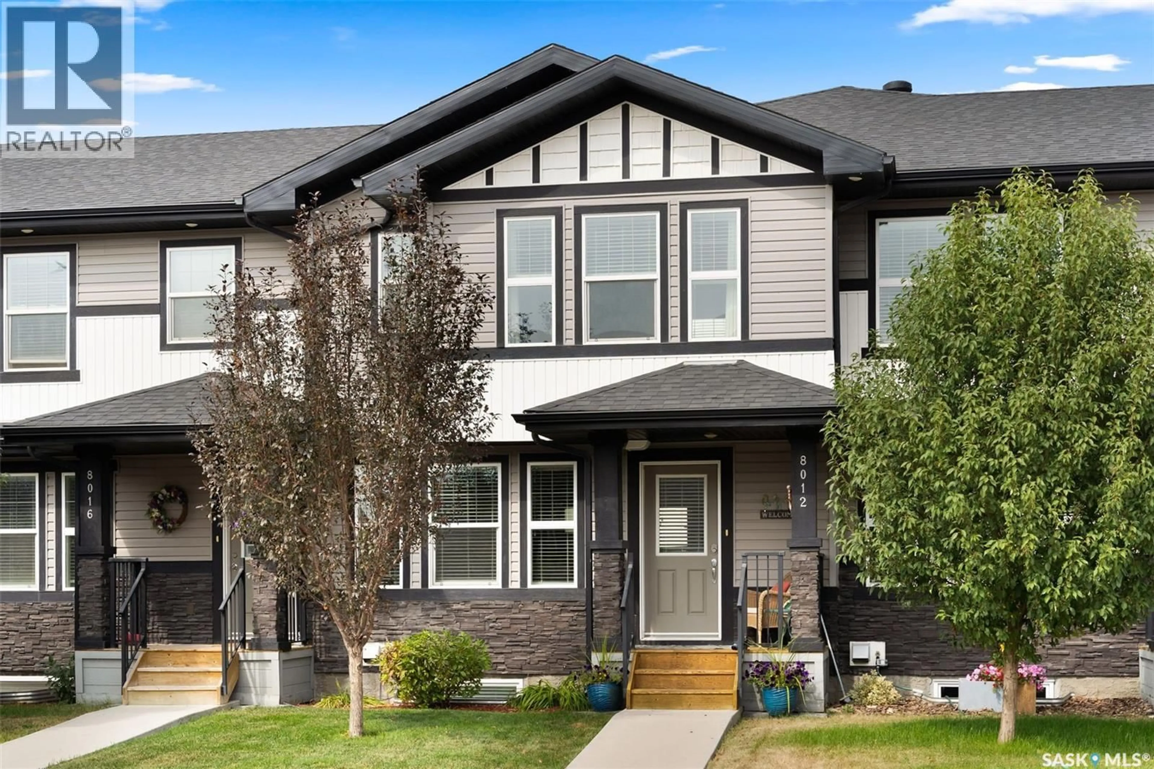 Home with vinyl exterior material, street for 8012 CANOLA AVENUE, Regina Saskatchewan S4Y0E7