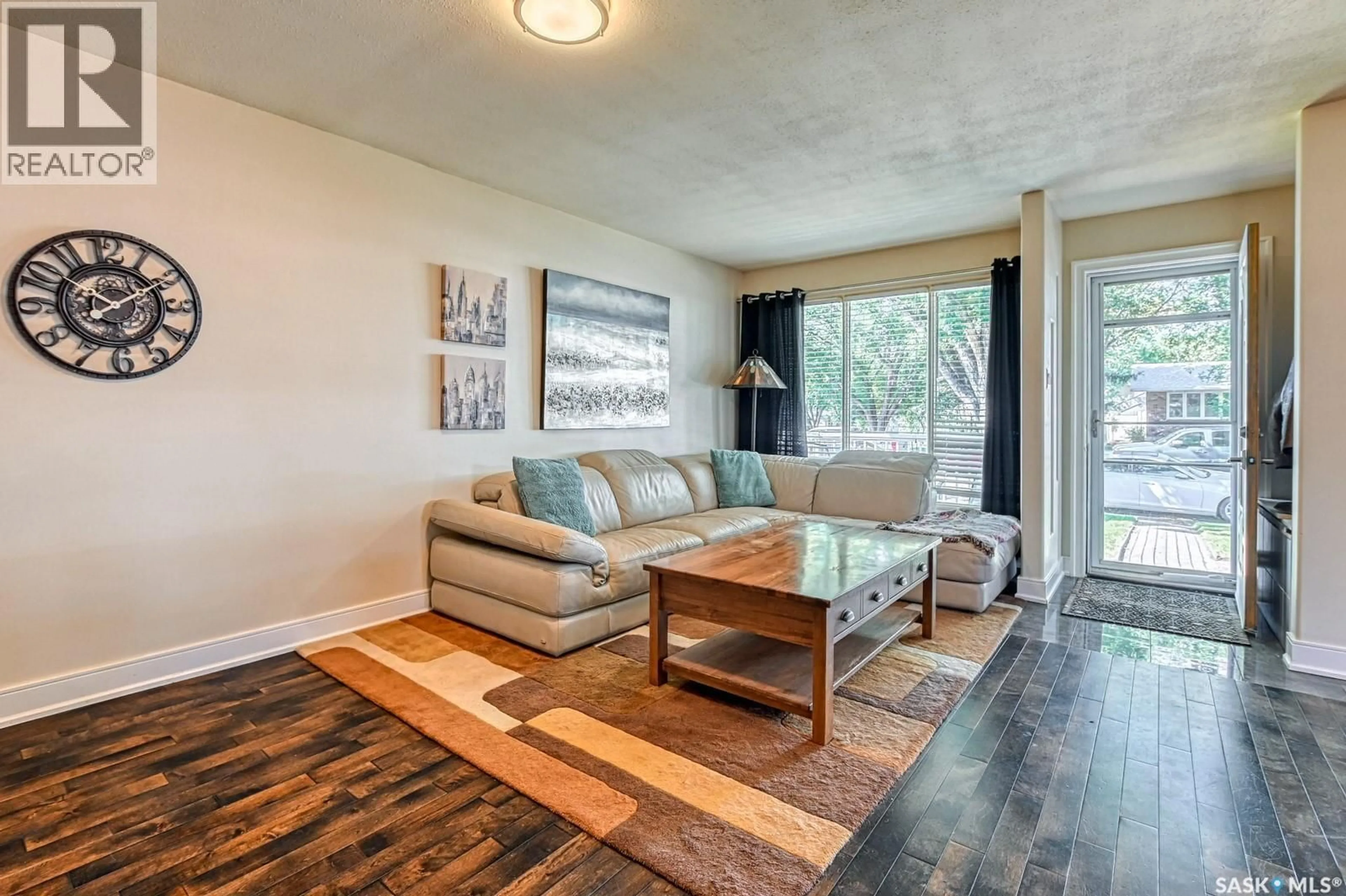 Living room with furniture, wood/laminate floor for 1065 HOWSON STREET, Regina Saskatchewan S4T6E8
