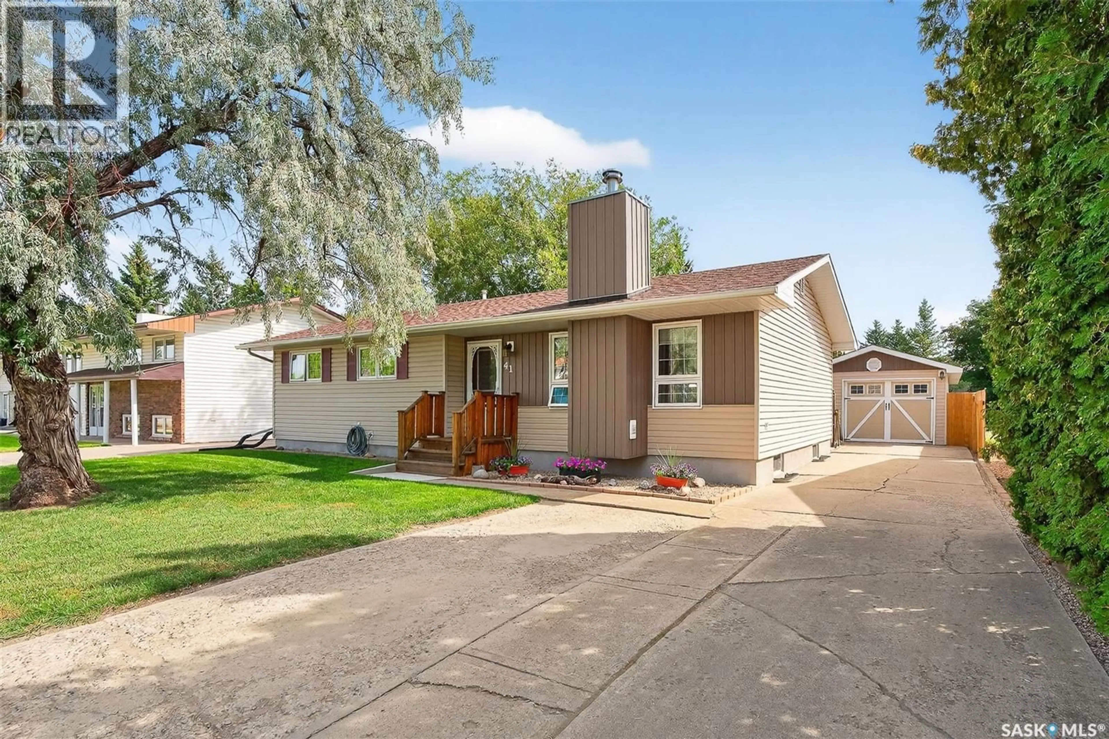 Home with vinyl exterior material, street for 41 BLUE SAGE DRIVE, Moose Jaw Saskatchewan S6J1A5