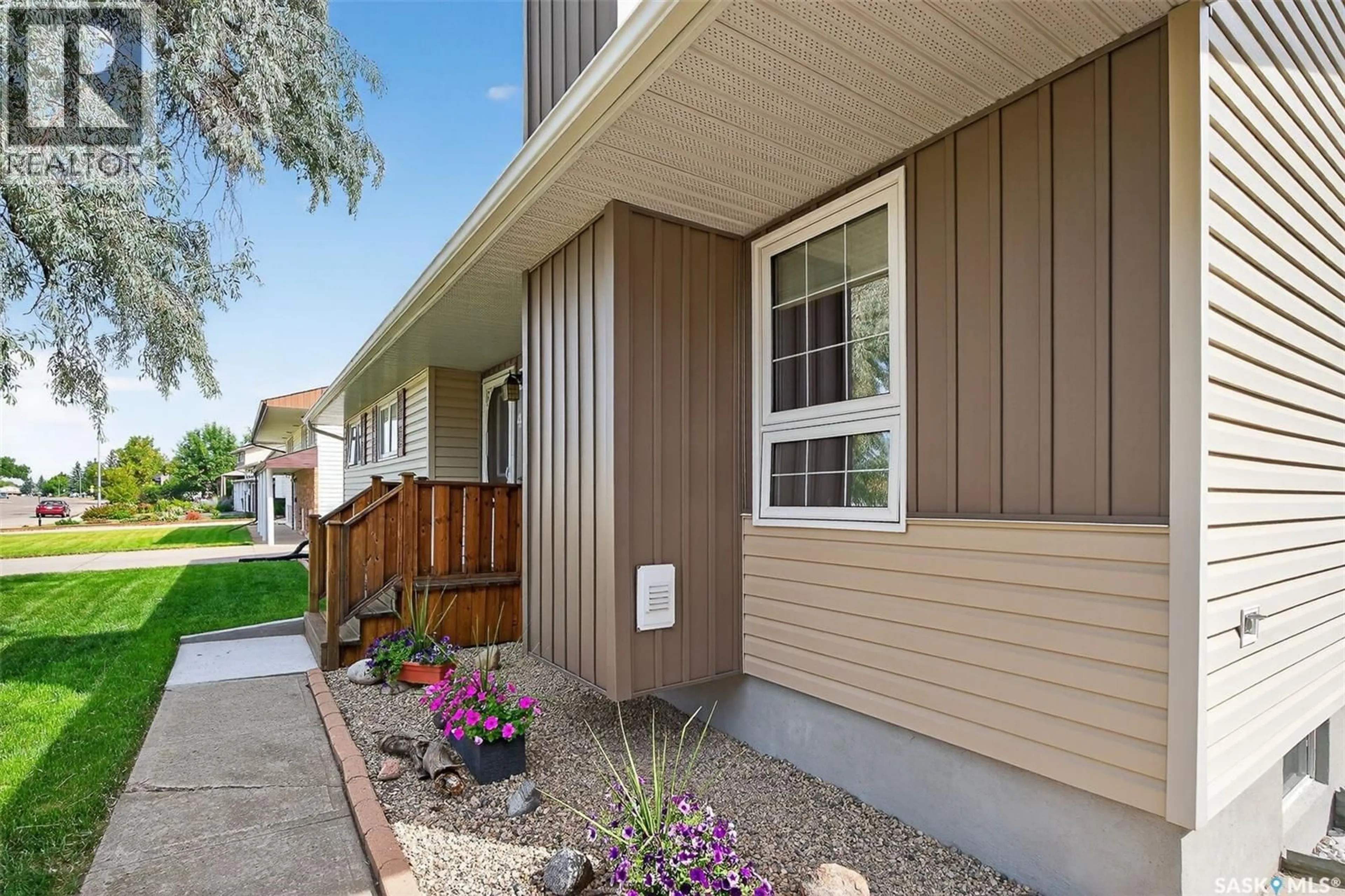 Home with vinyl exterior material, street for 41 BLUE SAGE DRIVE, Moose Jaw Saskatchewan S6J1A5