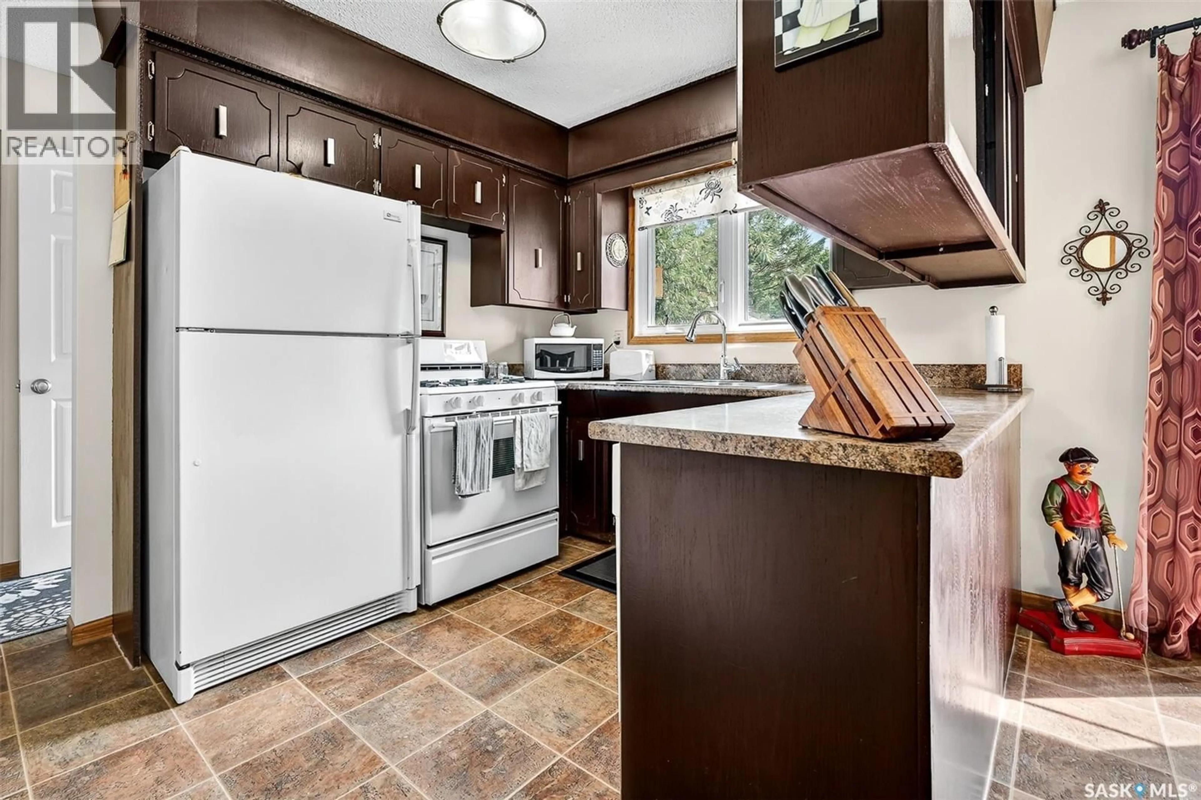 Standard kitchen, ceramic/tile floor for 41 BLUE SAGE DRIVE, Moose Jaw Saskatchewan S6J1A5