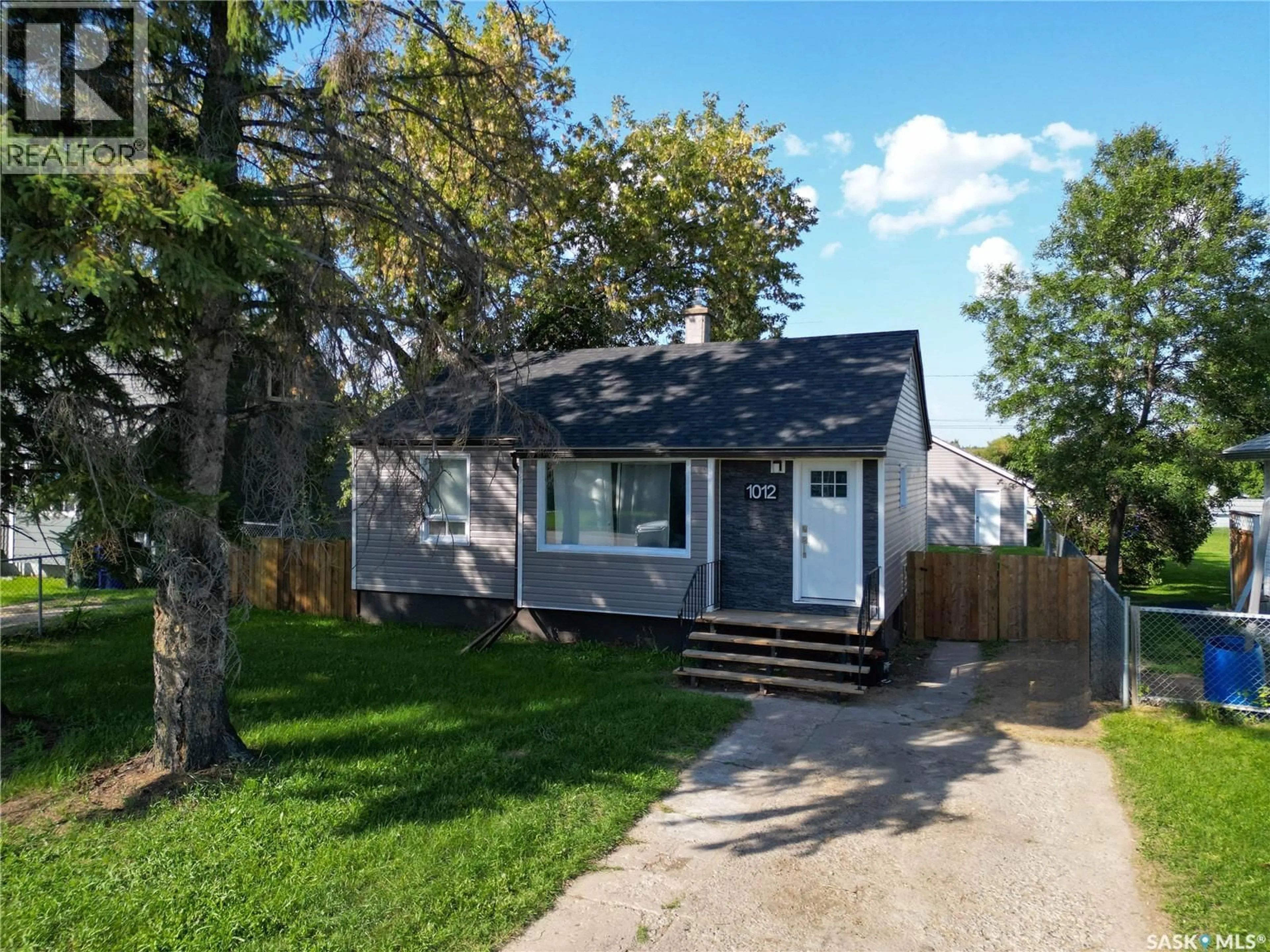 Home with vinyl exterior material, street for 1012 4TH STREET, Prince Albert Saskatchewan S6V0K9