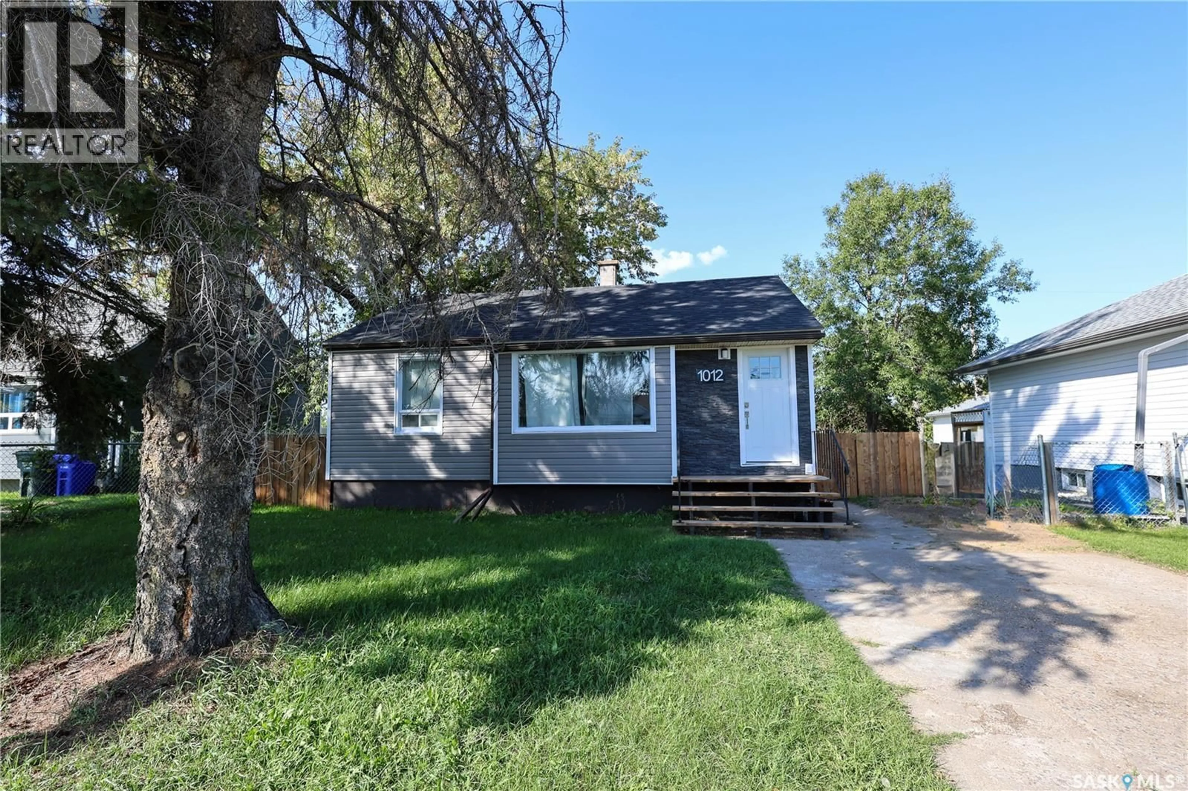 Home with vinyl exterior material, street for 1012 4TH STREET, Prince Albert Saskatchewan S6V0K9