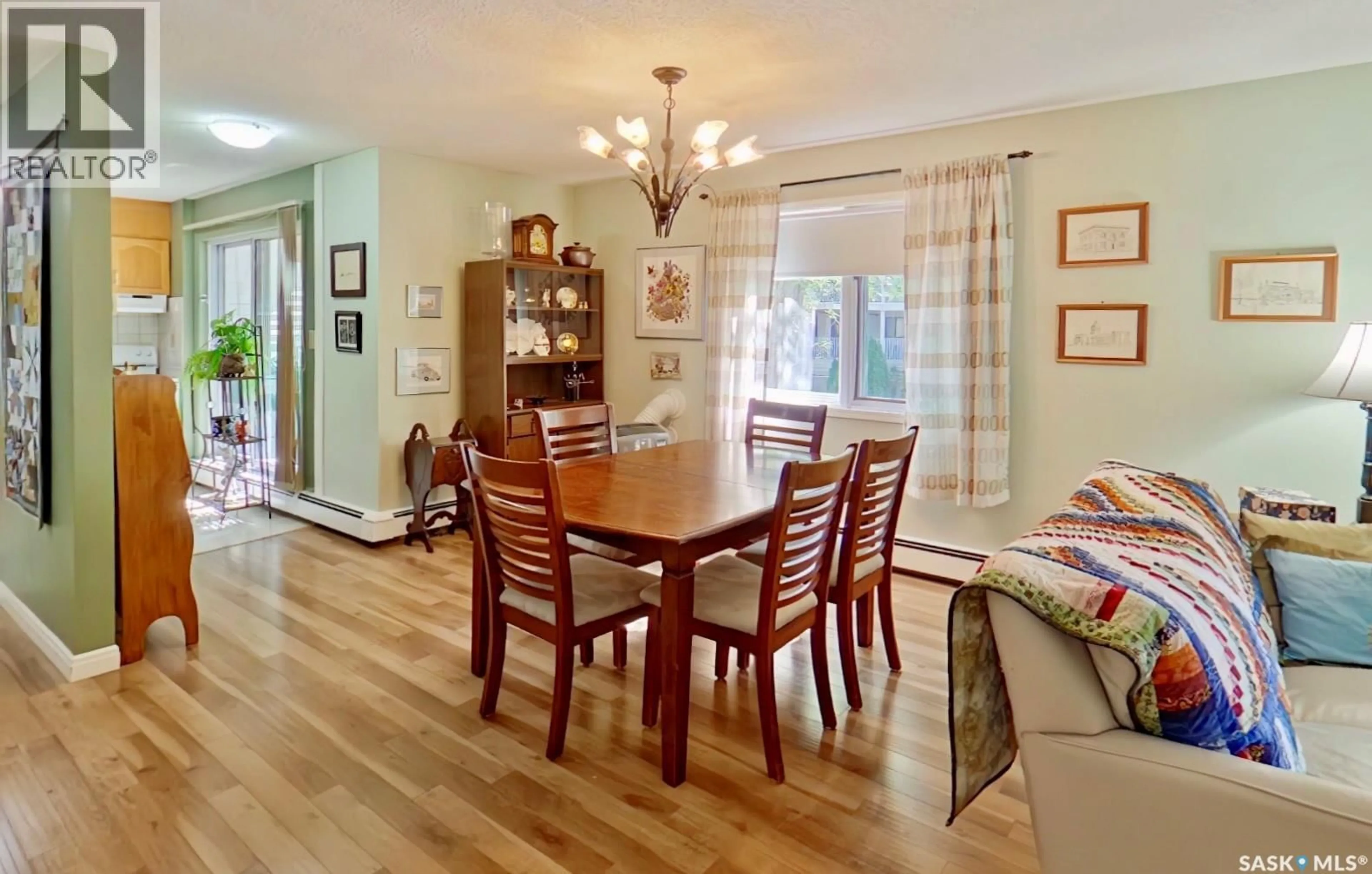 Dining room, wood/laminate floor for 204 - 2275 MCINTYRE STREET, Regina Saskatchewan S4P2S1