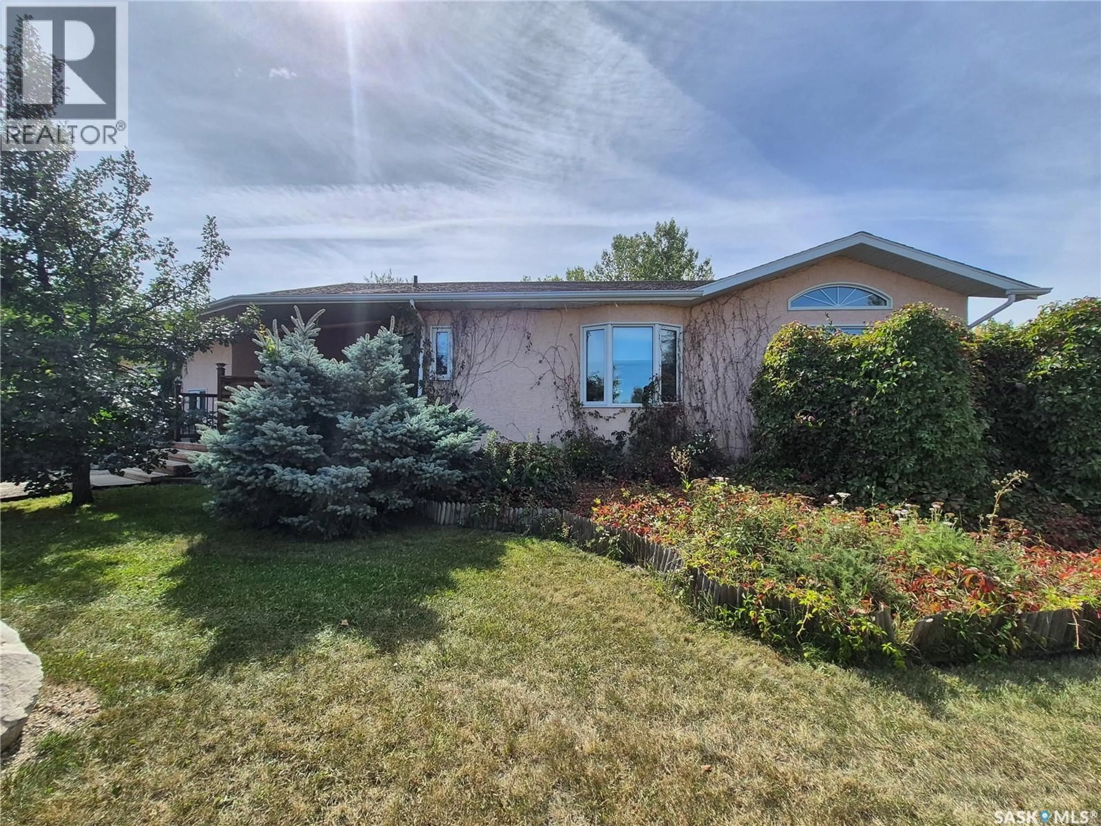 Home with vinyl exterior material, street for 713 RAILWAY AVENUE, Midale Saskatchewan S0C1S0